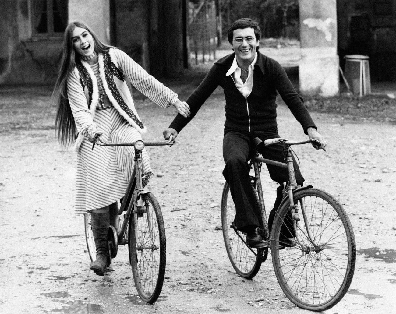 Al Bano And Romina Power Smiling On Bicycles In Milan, 1970S.