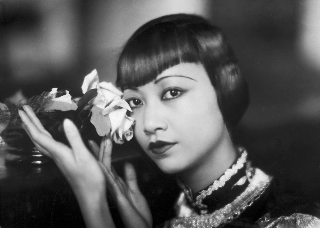 Anna May Wong Posing With A Cut Rose, 1935.