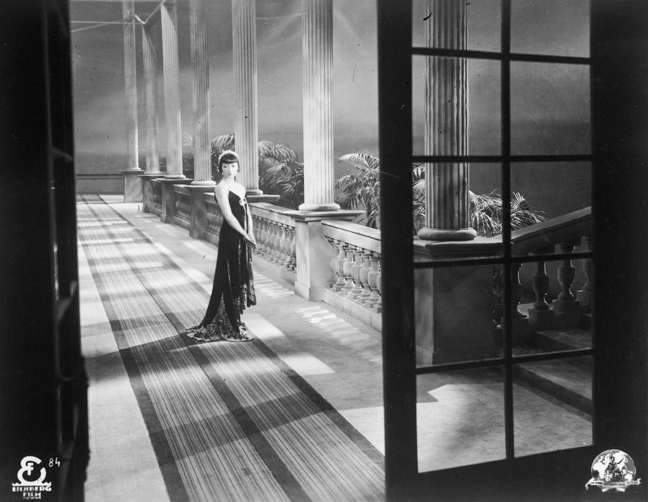 American-Chinese Actress Anna May Wong Beside A Row Of Columns, Circa 1930.