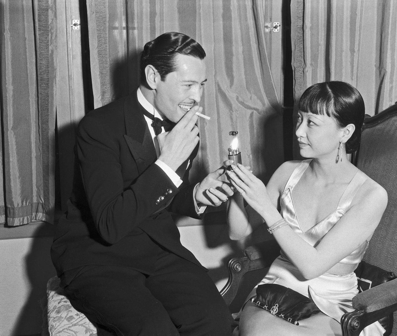 Anna May Wong Assisting Ivan Lebedef With A Light At Harry Lachman'S Party, Beverly Hills, 1929