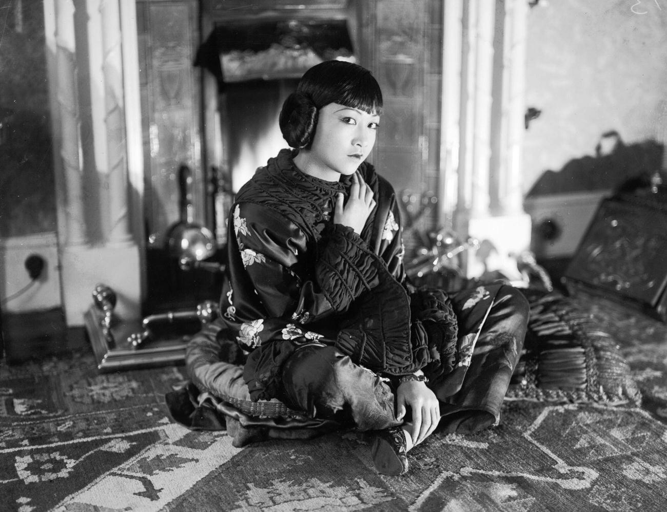 Anna May Wong Sitting On The Floor In A Wrap, November 1928.