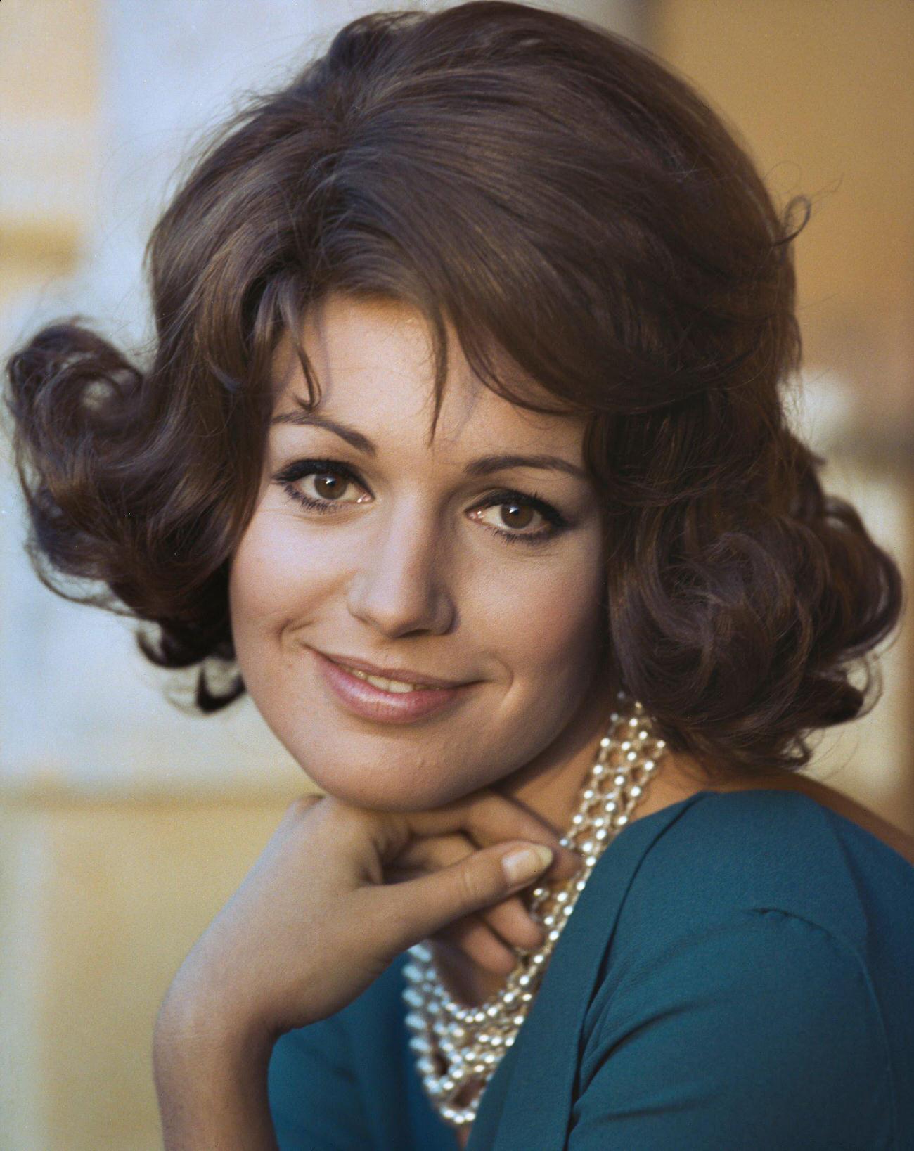 Catherine Spaak In A Blue Dress And Pearl Necklace, Circa 1967.