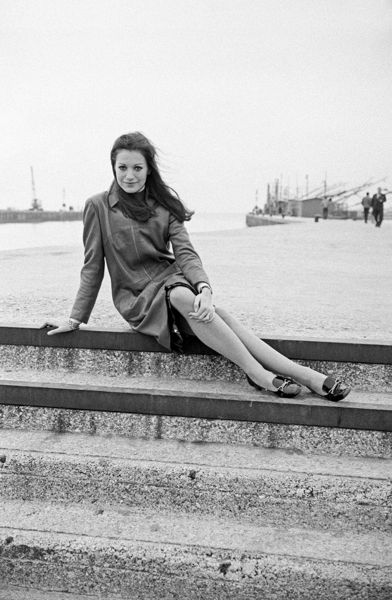 Catherine Spaak Seated On A Jetty, 1968.