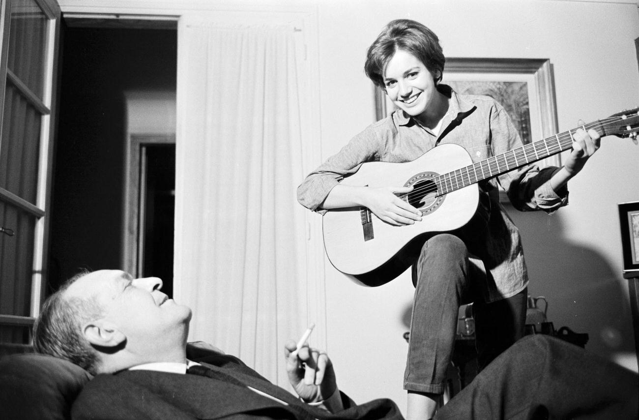 Catherine Spaak Playing Guitar In Paris, March 1961.