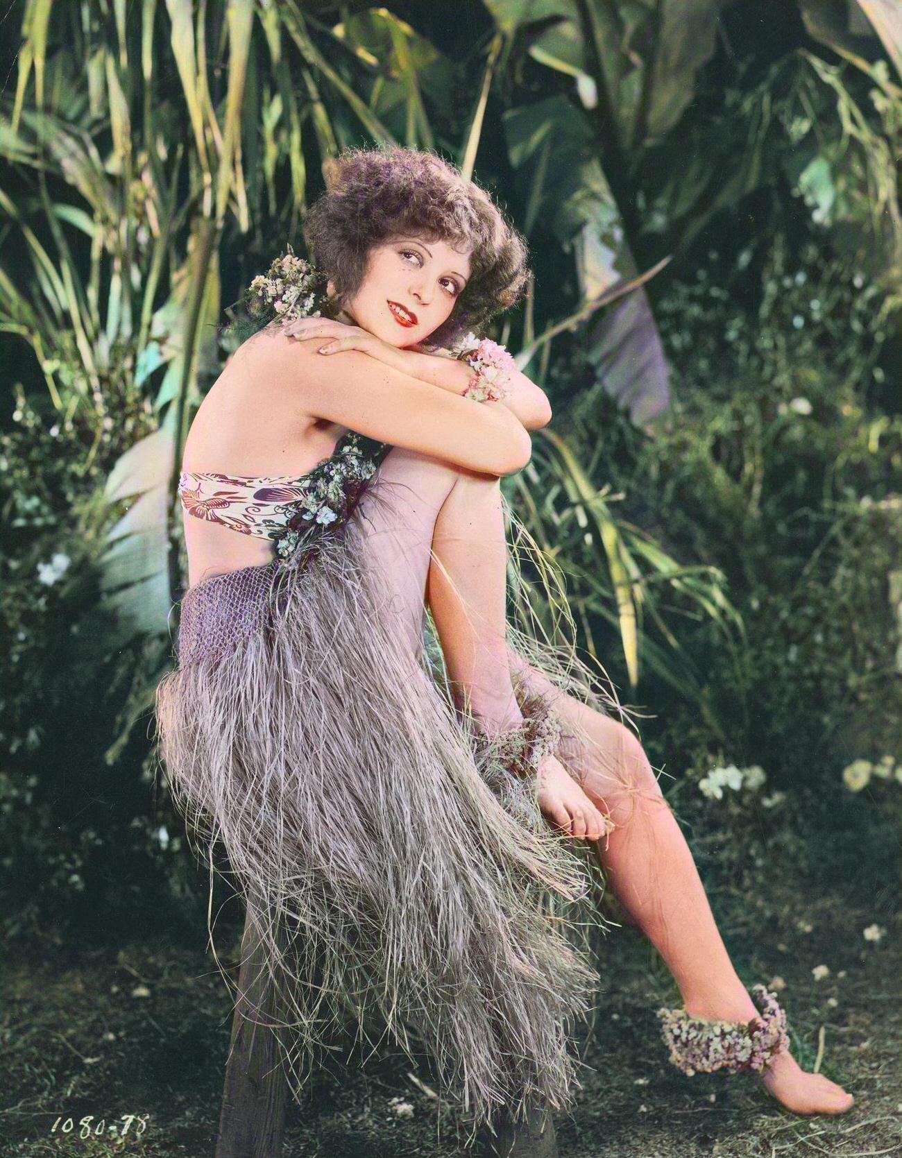 Clara Bow Seated In A Grass Skirt From An Unidentified Film, 1920S