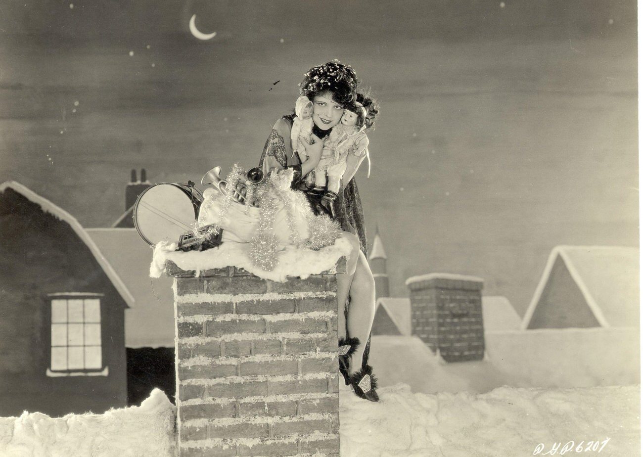 Clara Bow Sitting On A Chimney With Toys, Circa 1950.