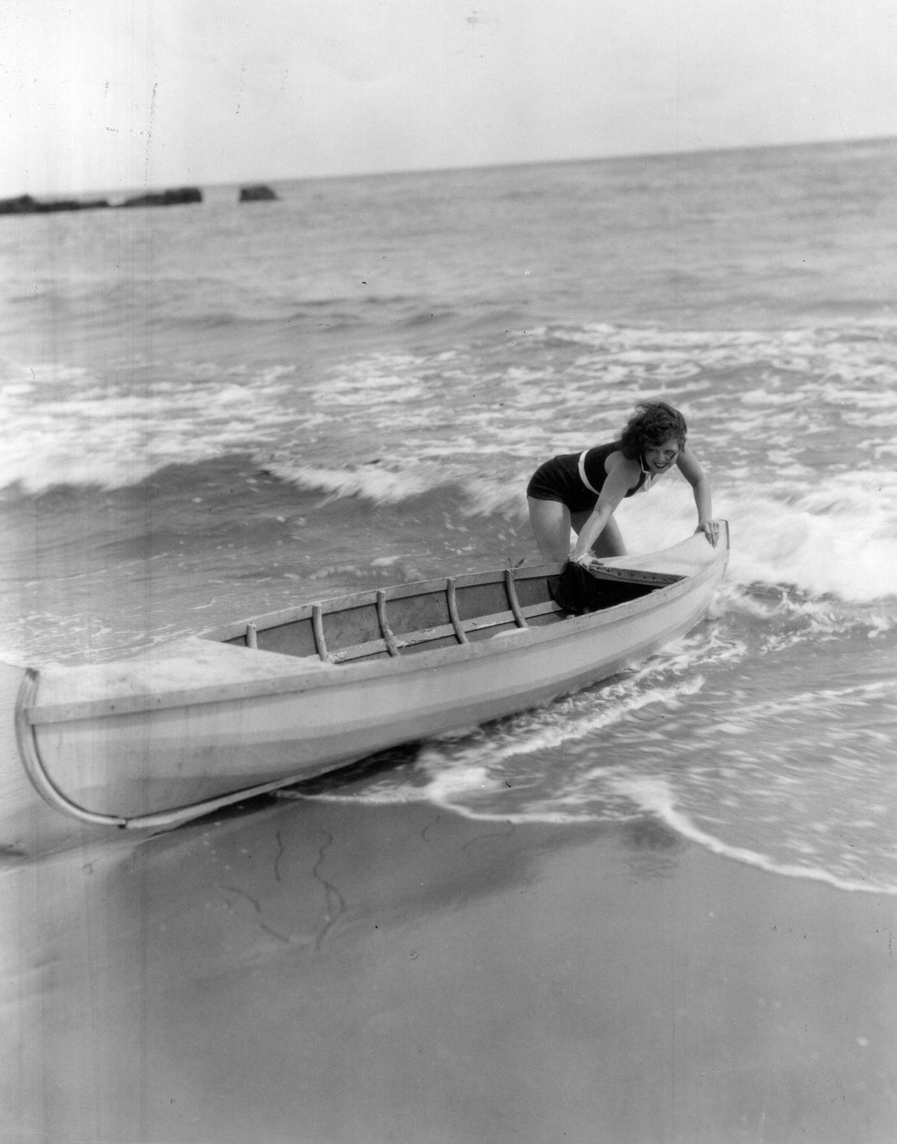 Clara Bow Launching A Canoe Outside Her Malibu Home, Circa 1926.