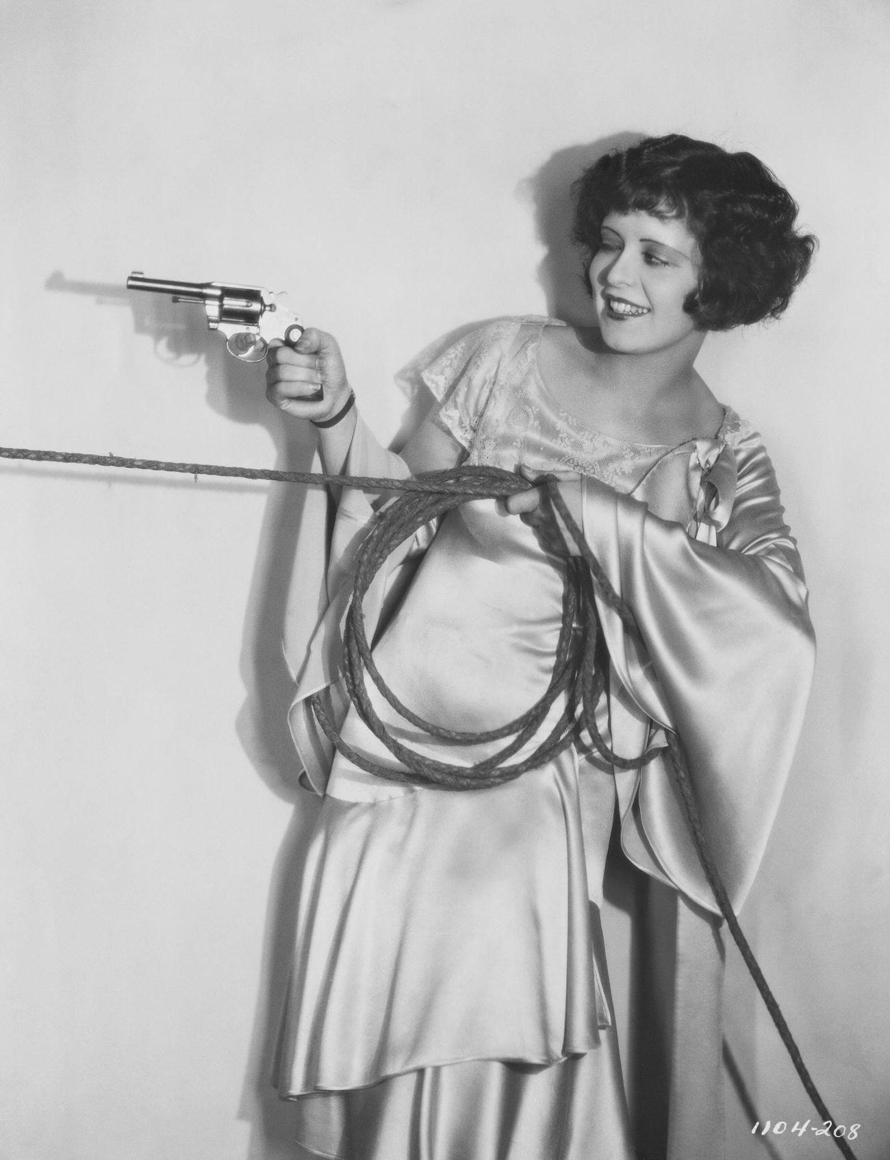 Clara Bow Holding A Revolver And Rope, 1920S