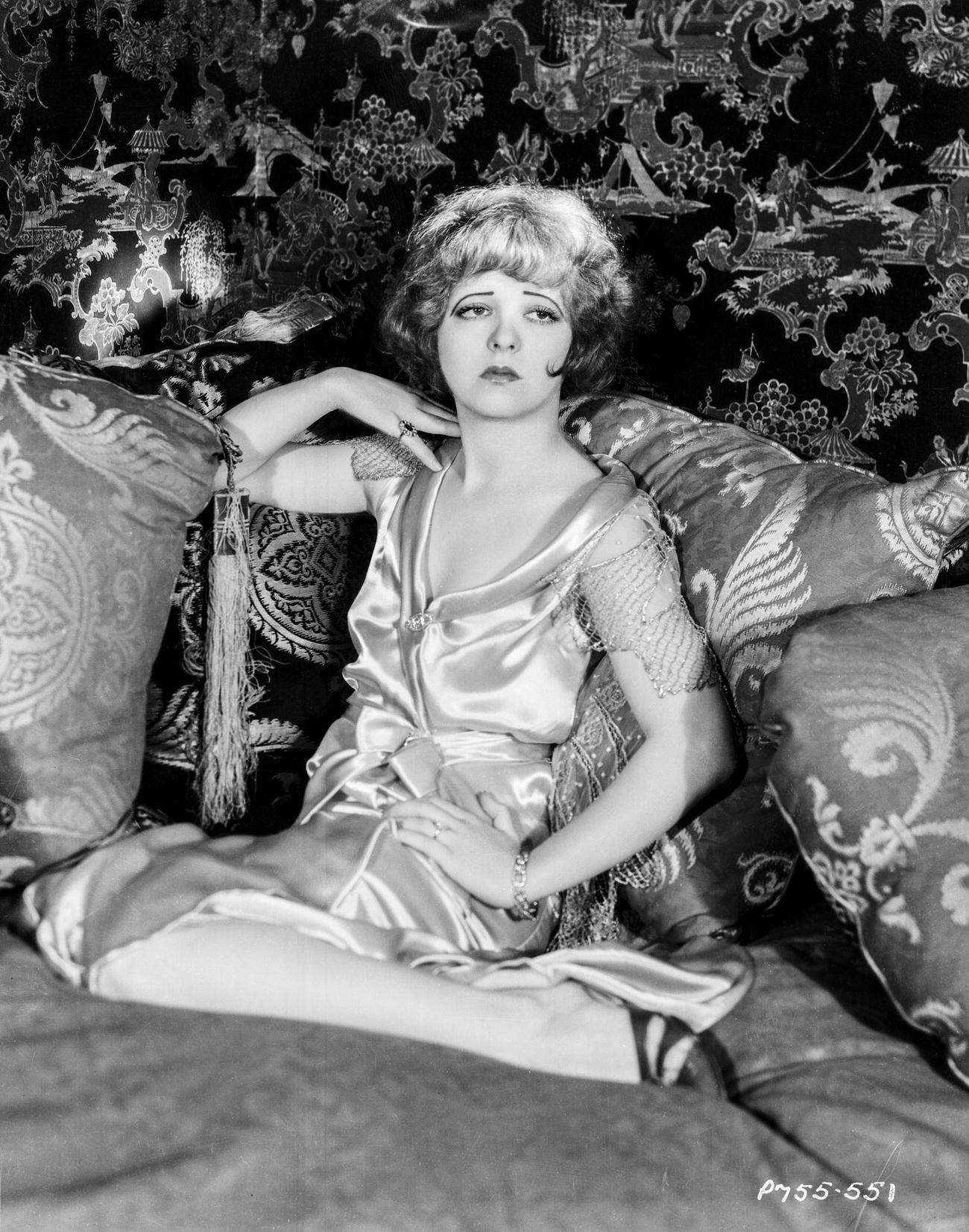 Clara Bow Sitting On A Pile Of Pillows, 1926.