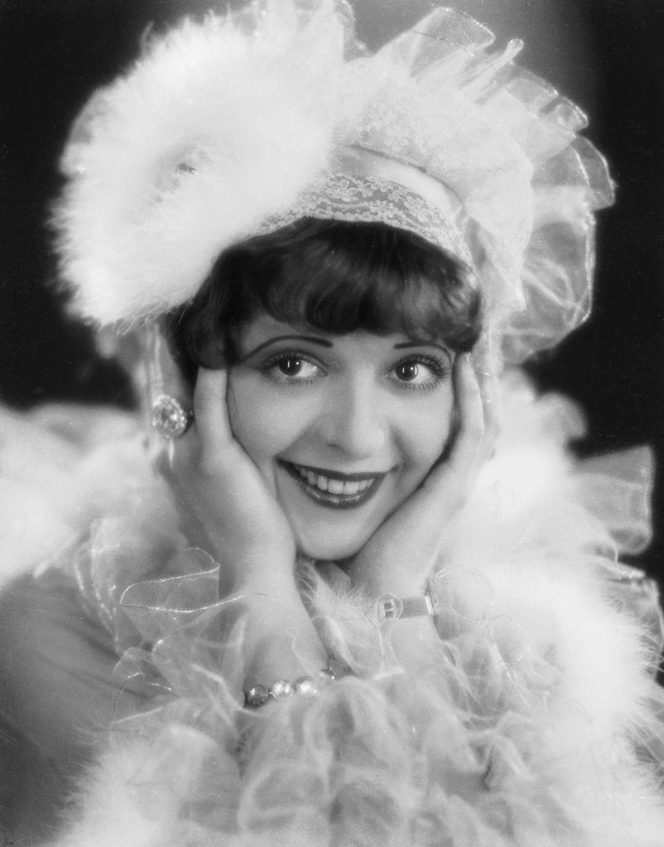 Clara Bow In A Frilly Hat And Dress, Circa 1928.