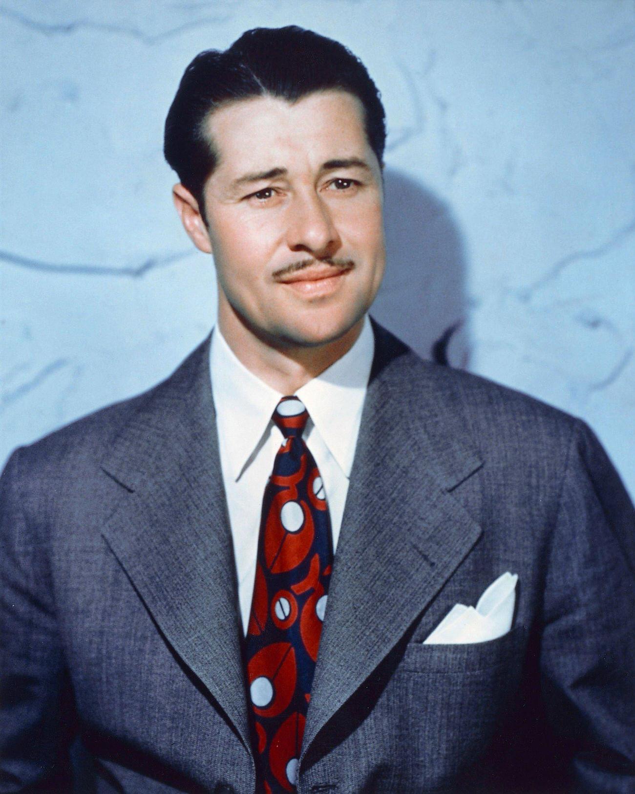 Don Ameche Wearing A Grey Suit Jacket, White Shirt, And Red, White, And Blue Tie, Circa 1940.