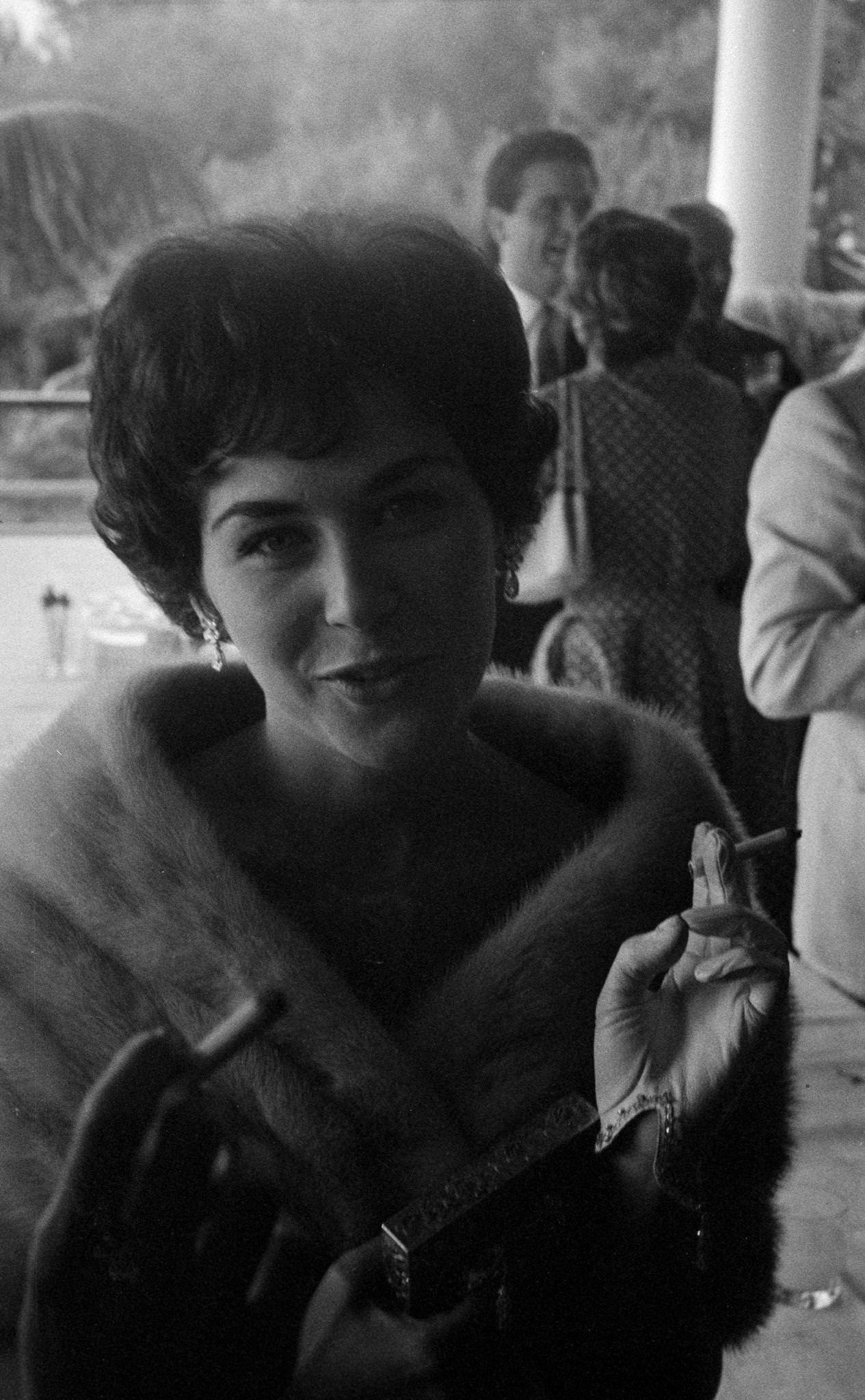 Eva Bartok Smiling With A Cigarette At The Cannes Film Festival, May 1957.