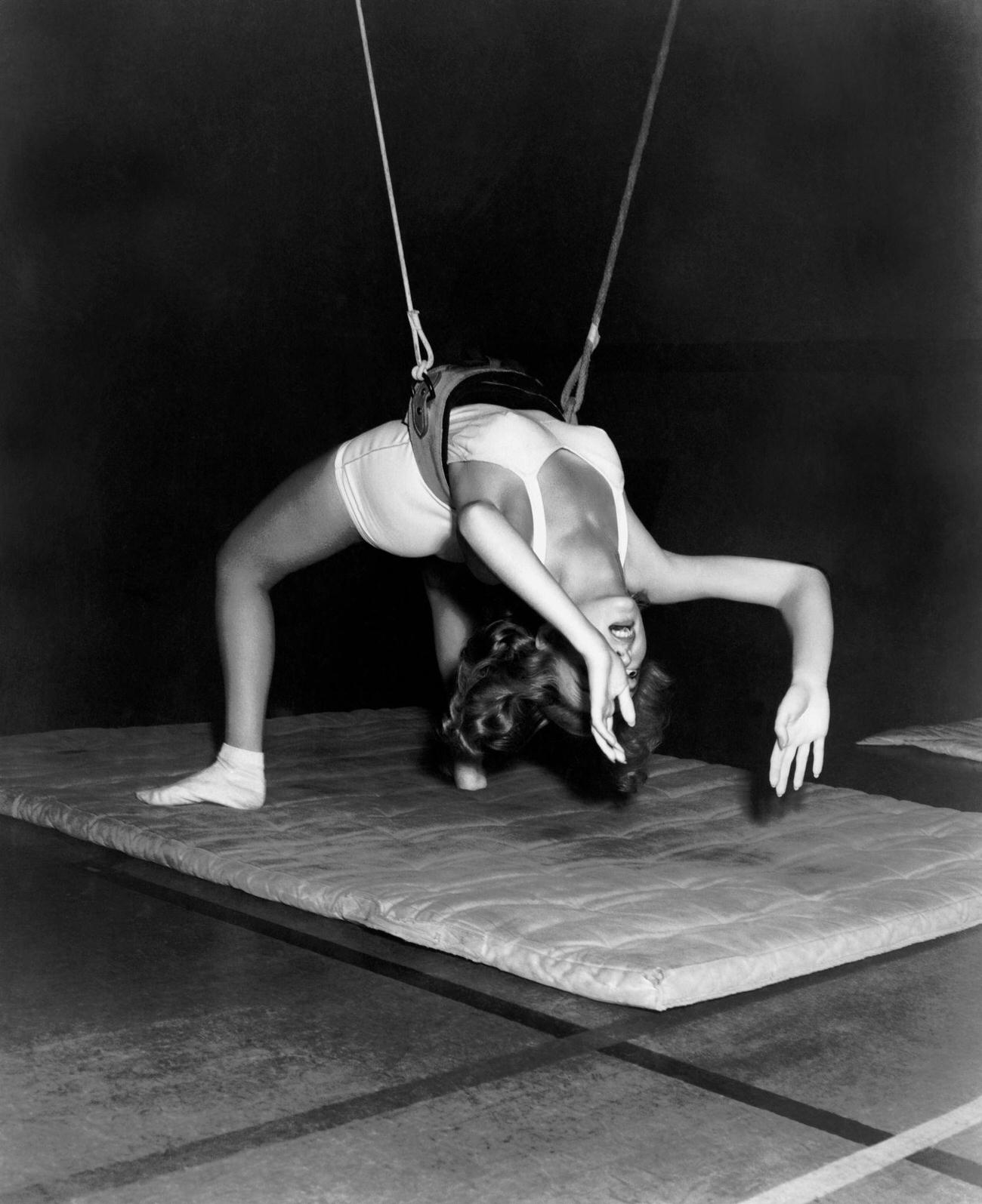 Evelyn Keyes Exercising With A Gymnasium Harness, 1943.