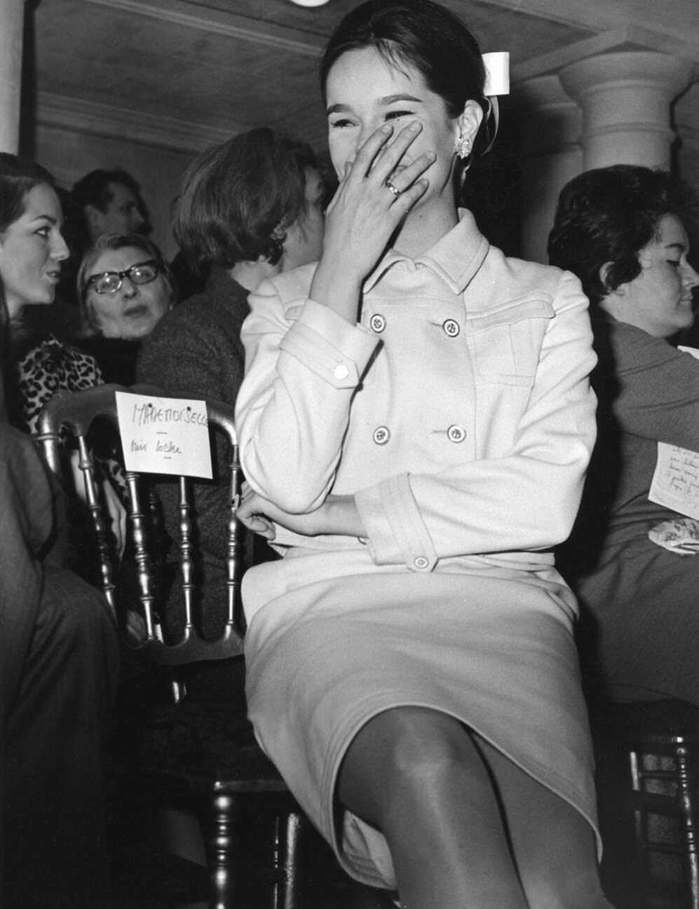 Geraldine Chaplin Watching A Fashion Show Of Designer Ted Lapidus, January 28, 1966.