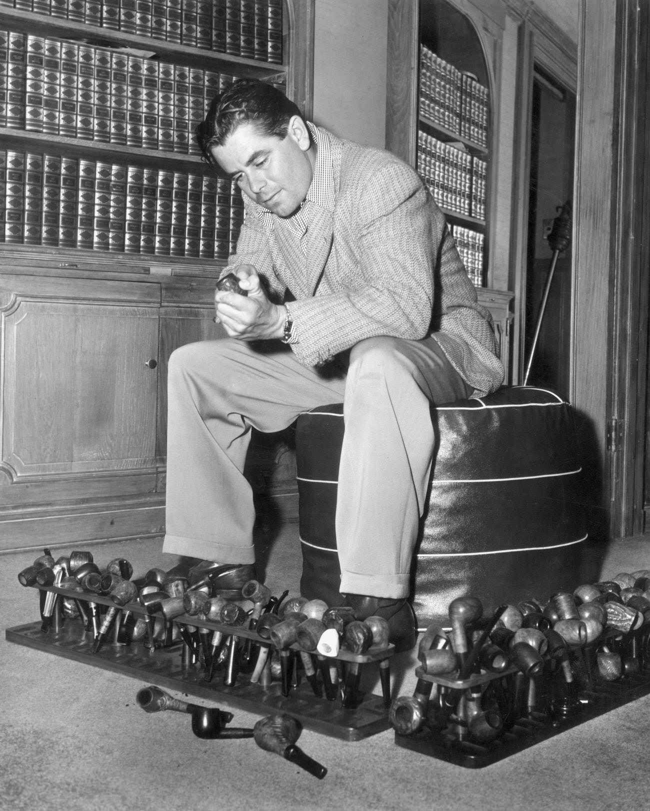 Glenn Ford Cleaning A Pipe With His Collection, Circa 1945.