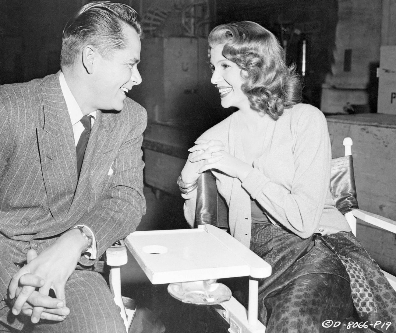 Rita Hayworth And Glenn Ford Chatting Between Takes During 'Affair In Trinidad'.