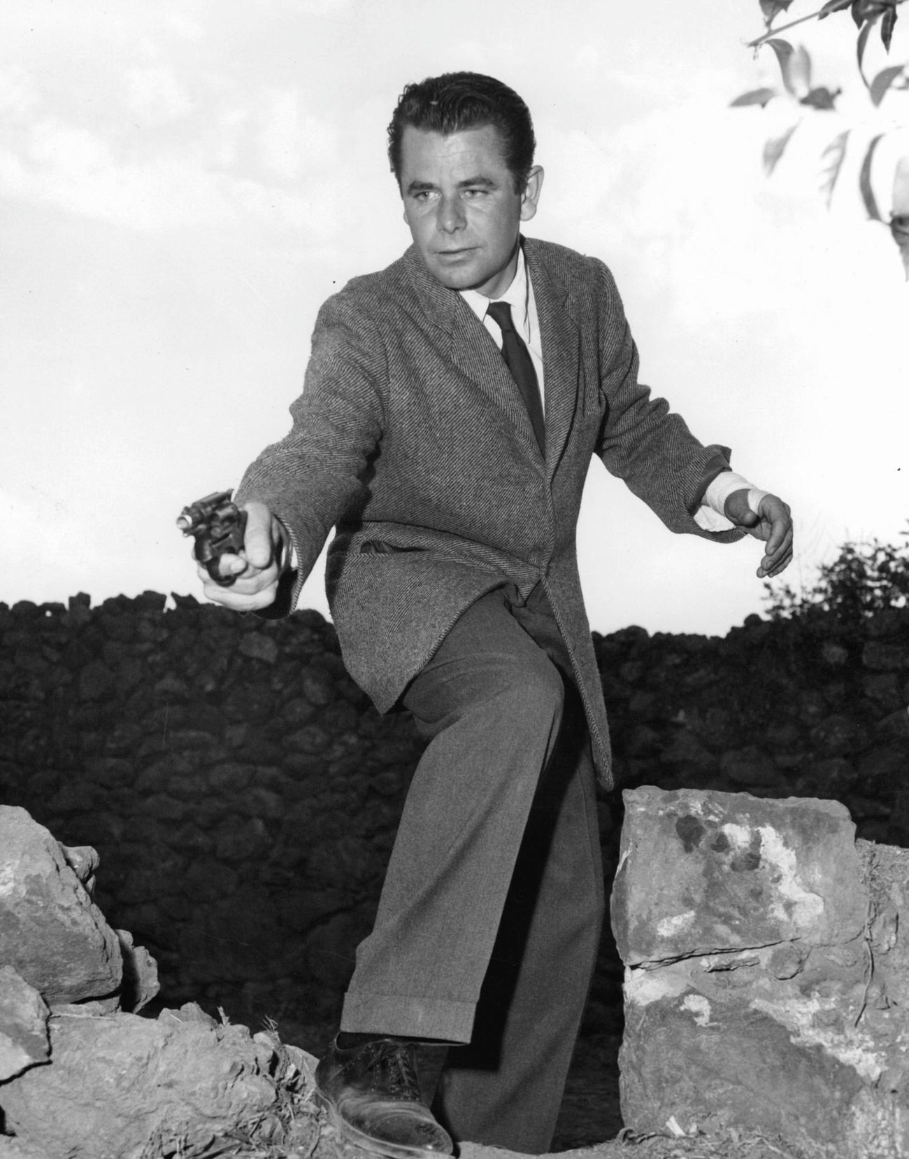 Glenn Ford Aiming A Gun In 'Plunder Of The Sun', 1953.