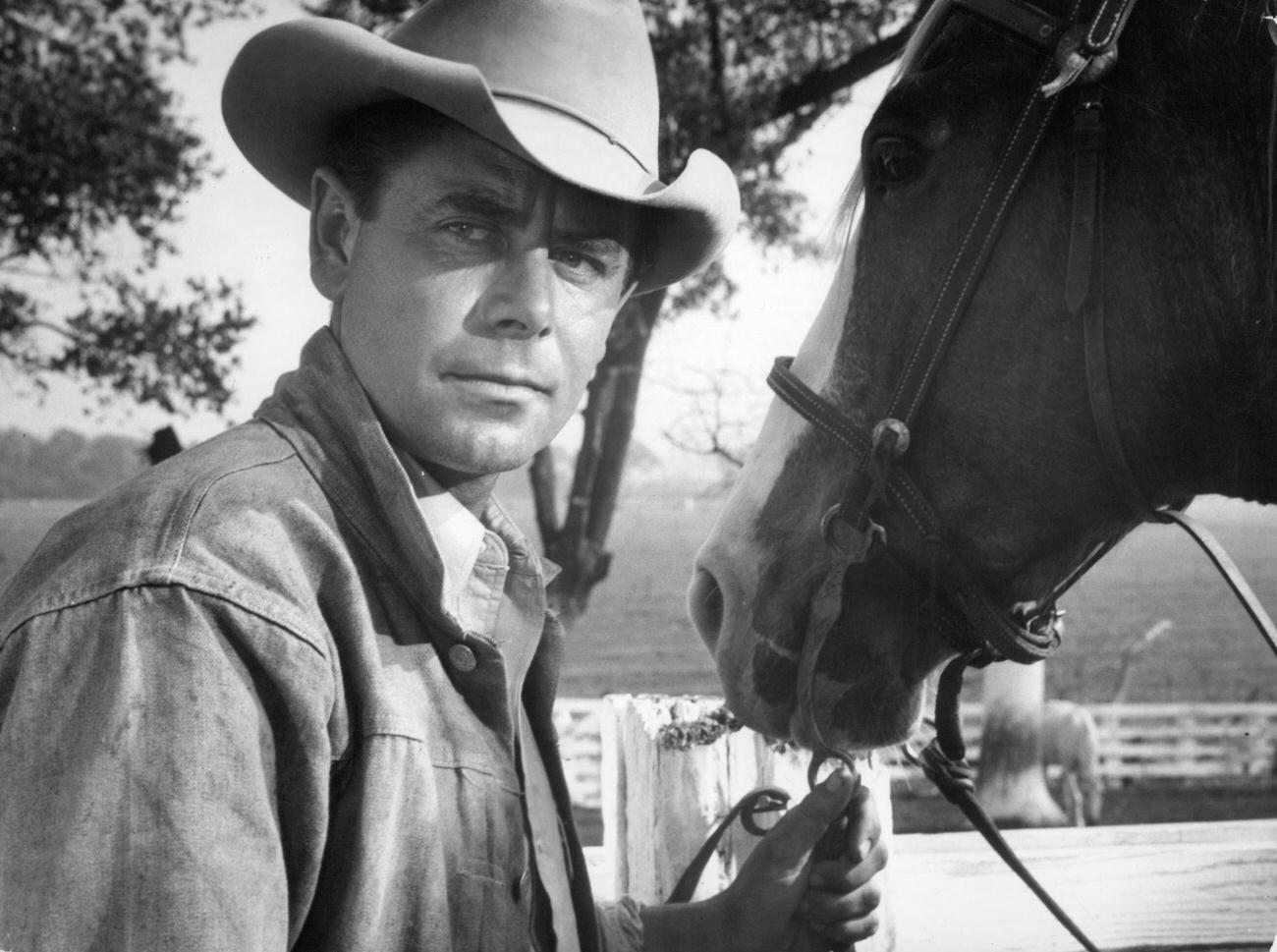 Glen Ford Face To Face With A Horse In 'The Americano', 1955.
