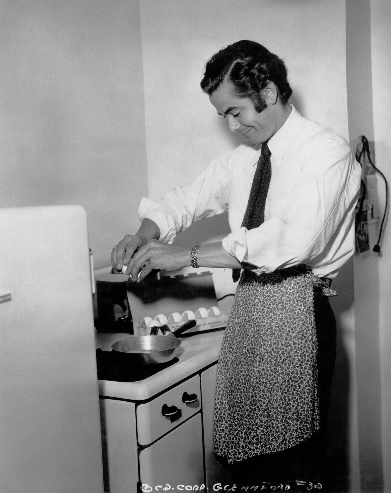 Glenn Ford Cooking An Omelette During The Making Of 'Texas', Circa 1941.