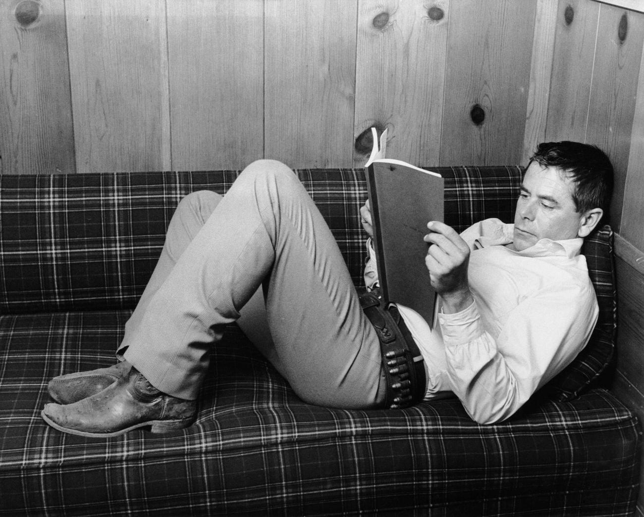 Glenn Ford Reads The Script On The Set Of 'The Sheepman', 1958.