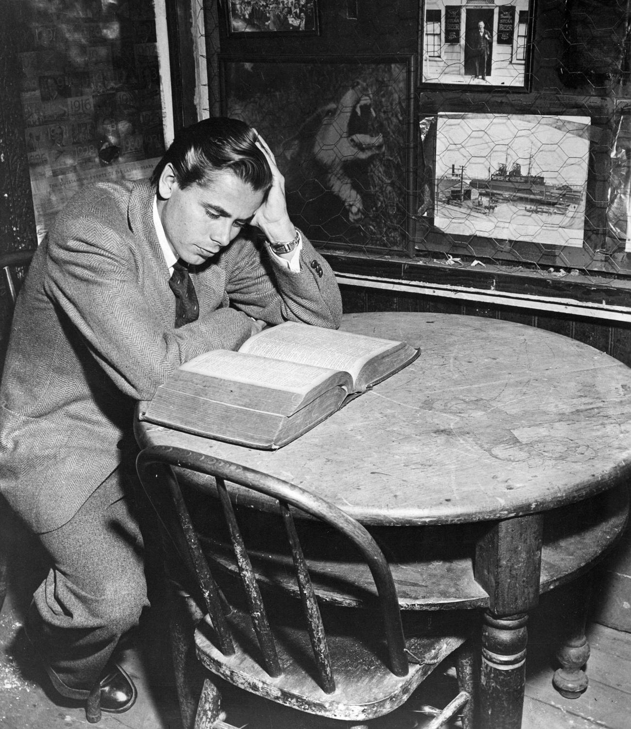 Glenn Ford At The &Amp;Quot;First And Last Chance Saloon&Amp;Quot; In Oakland, California, Reading Jack London'S First Dictionary, Circa 1942.