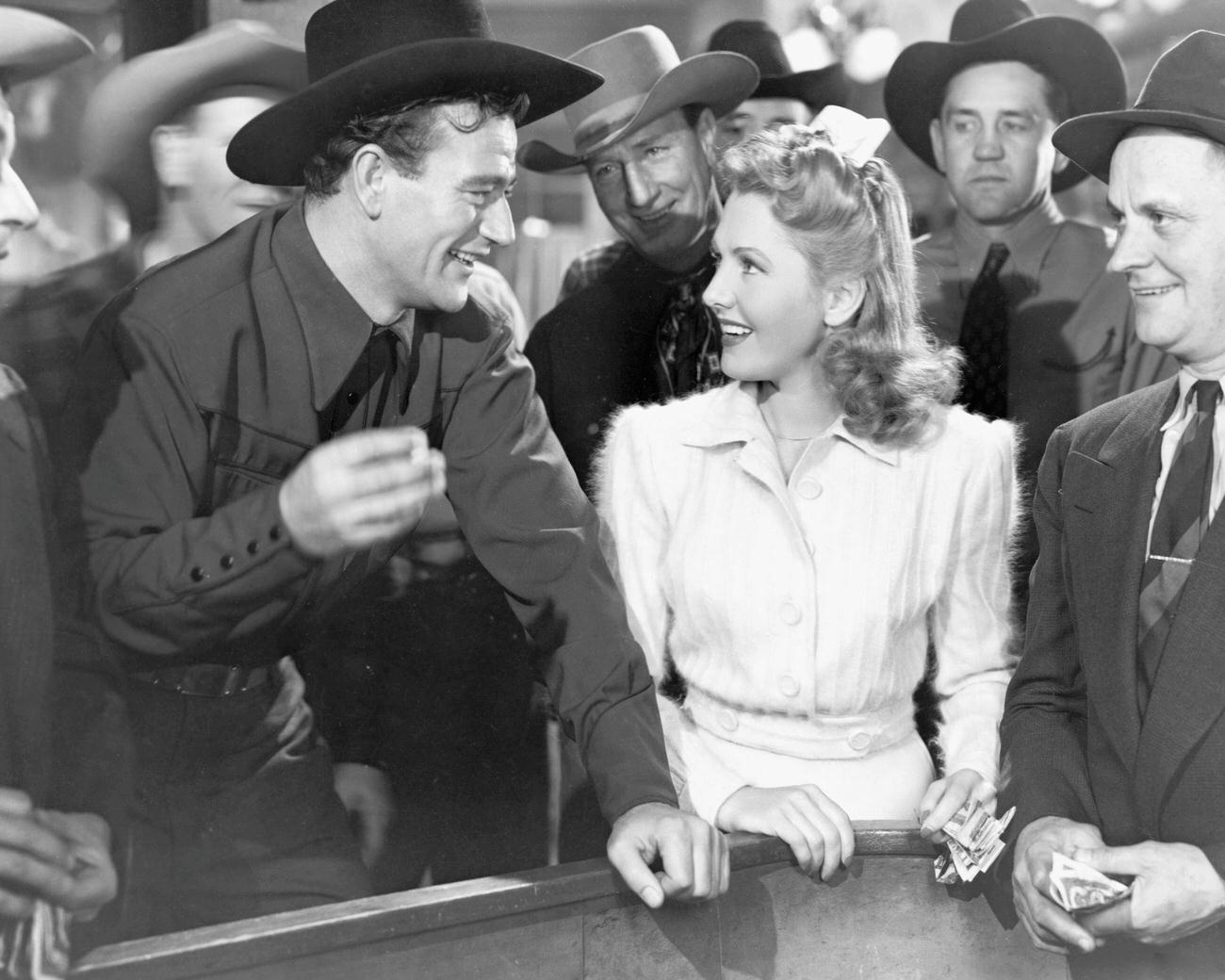 Jean Arthur And John Wayne In 'A Lady Takes A Chance', 1943.