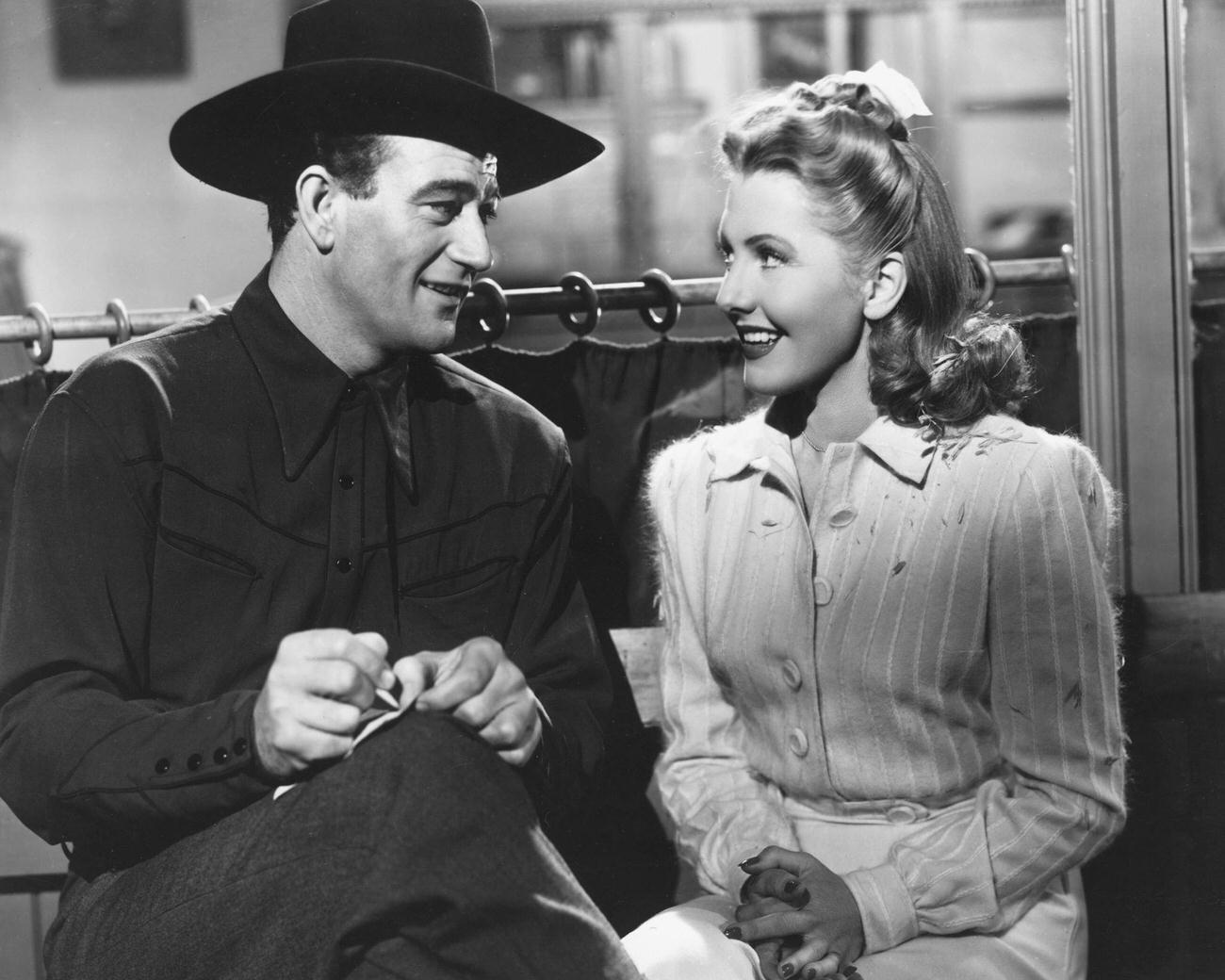 Jean Arthur And John Wayne In 'A Lady Takes A Chance', 1943.