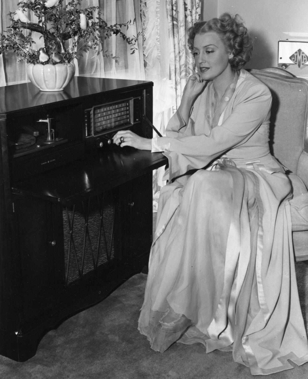 Jeanette Macdonald Adjusting A General Electric Model 417 Radio, 1946.