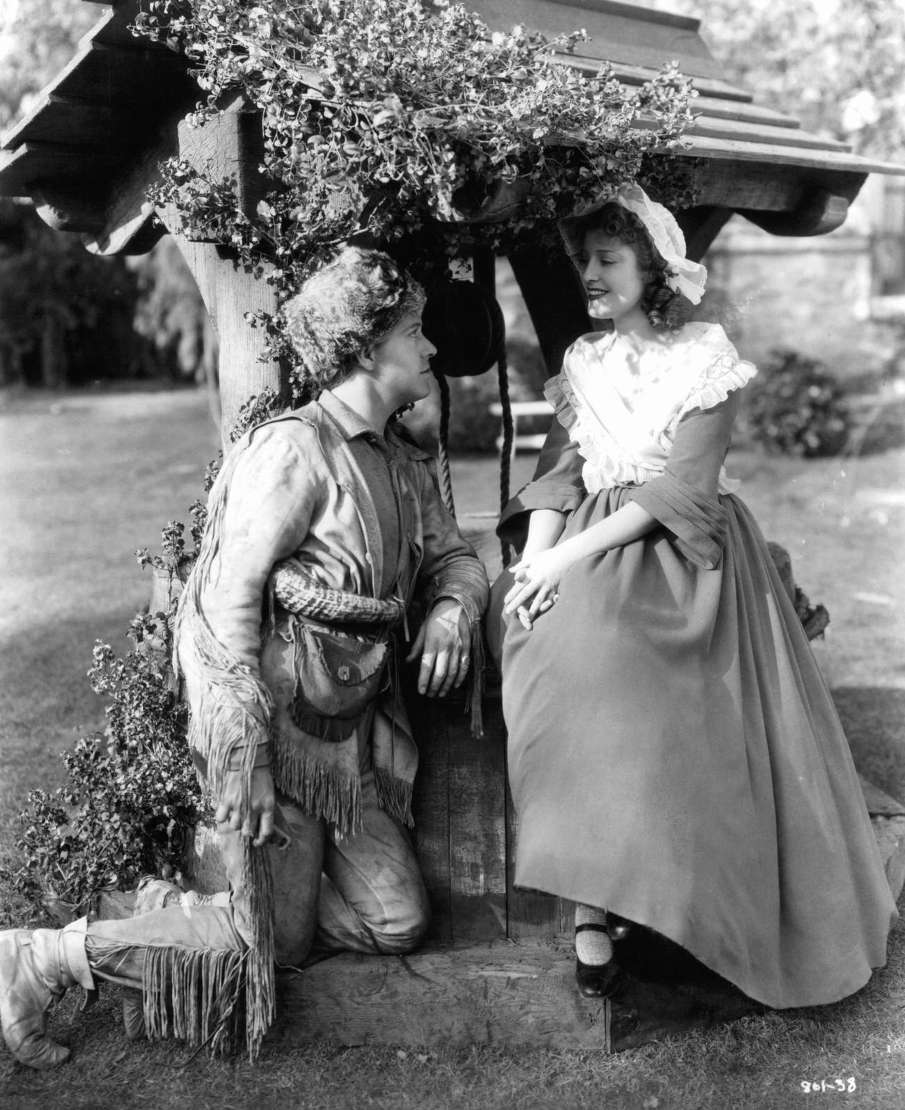 Nelson Eddy Kneels Before Jeanette Macdonald At A Well In A Scene From 'Naughty Marietta,' 1935.