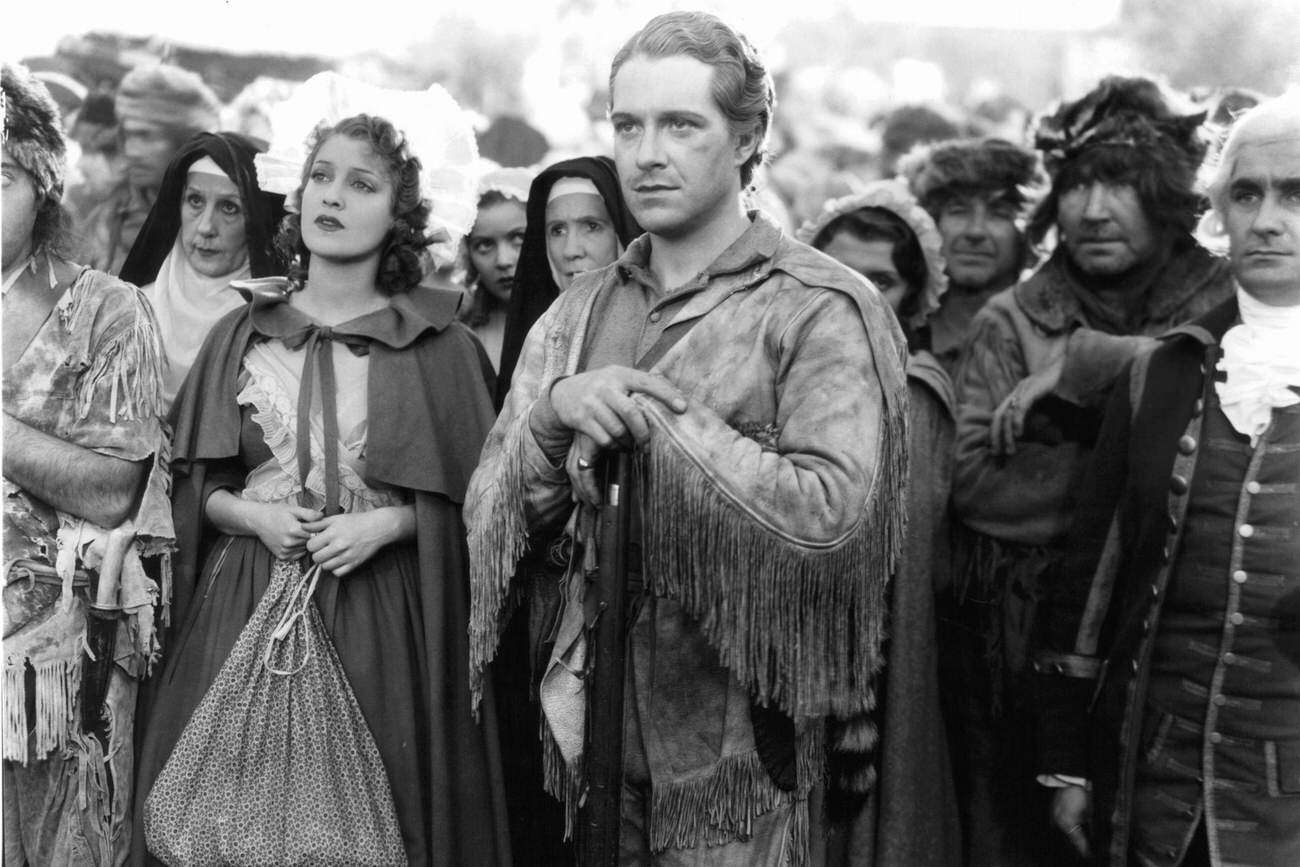 Jeanette Macdonald And Nelson Eddy With A Group Of People In A Scene From 'Naughty Marietta,' 1935.