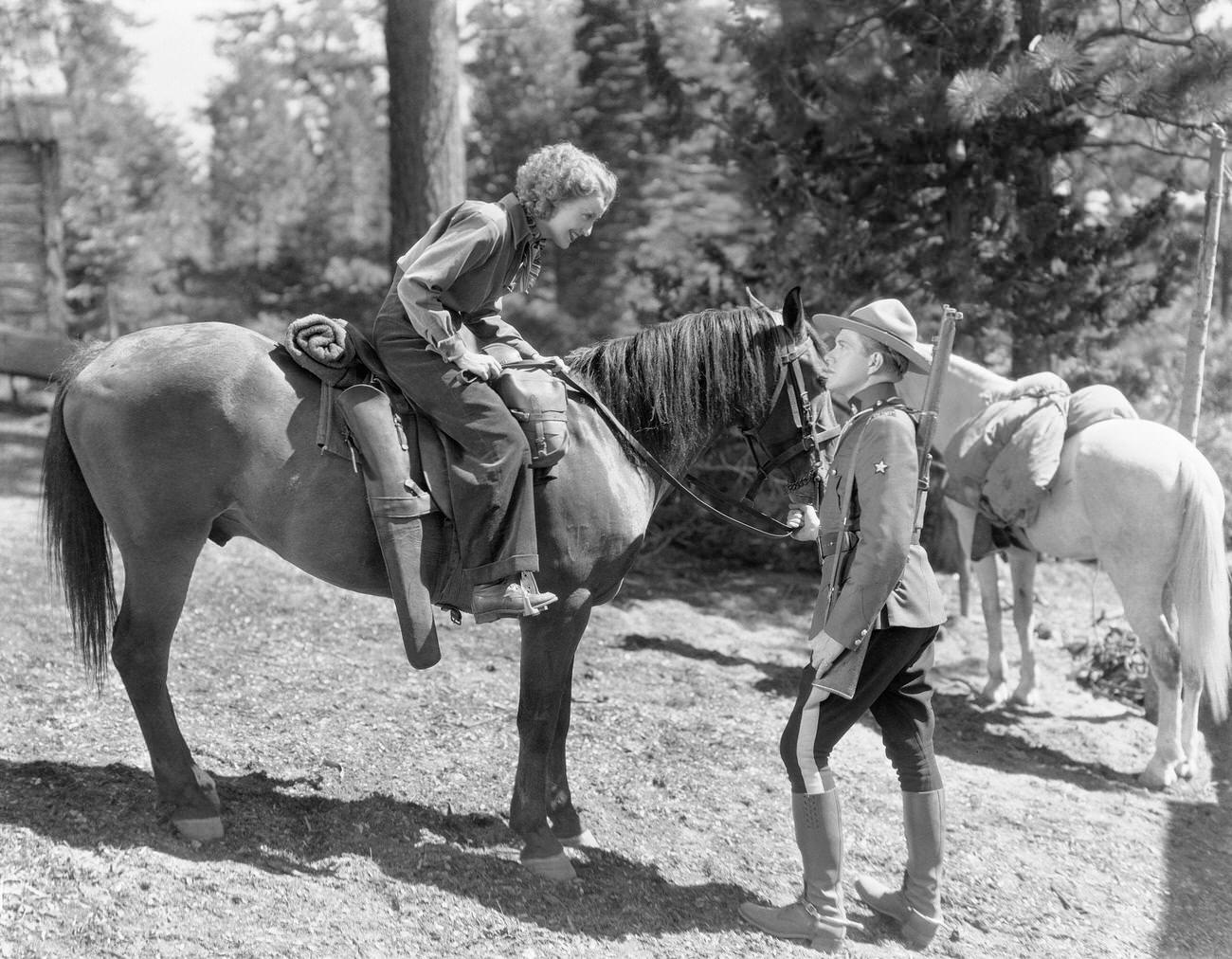 Nelson Eddy As A Canadian Mountie Talks With Jeanette Macdonald On Her Horse In 'Rose Marie,' 1936.