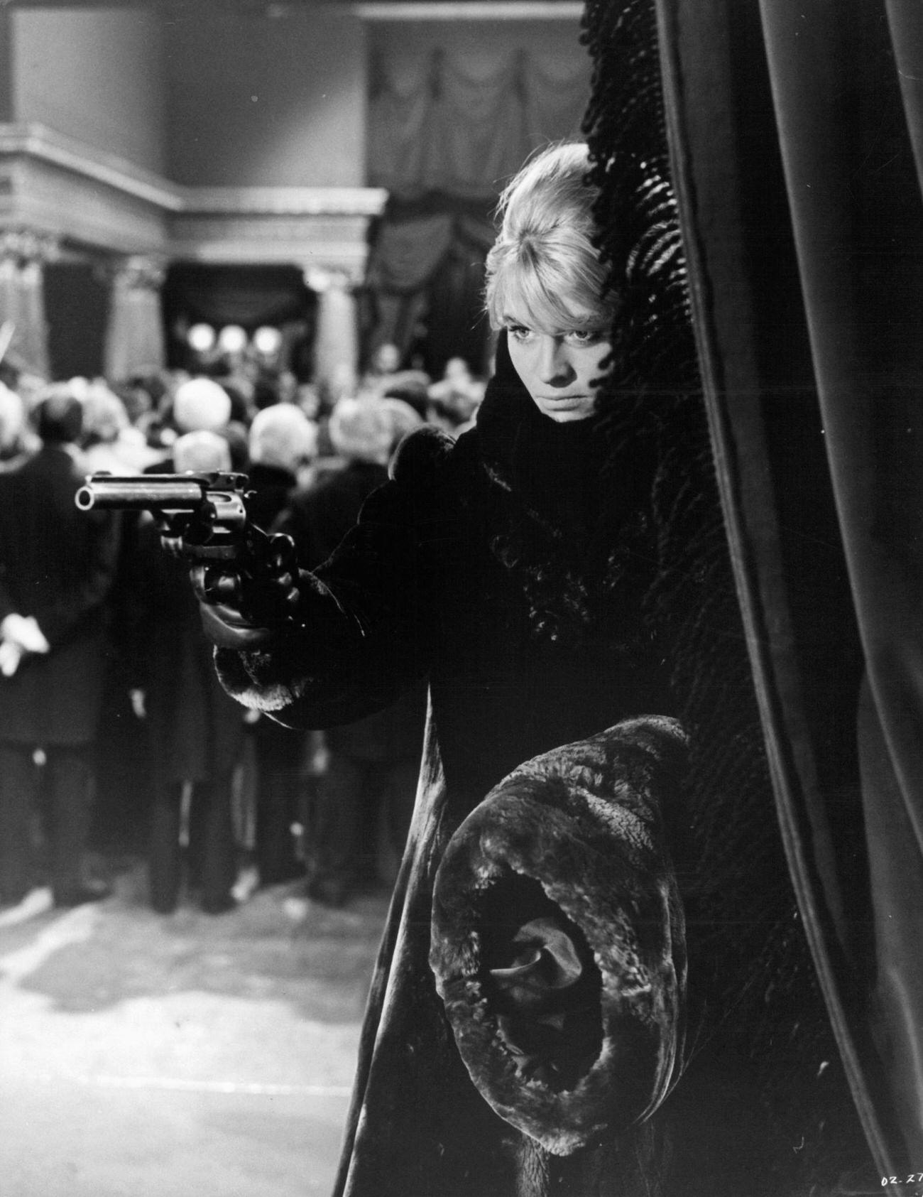 Julie Christie Pointing A Gun In 'Doctor Zhivago', 1965.