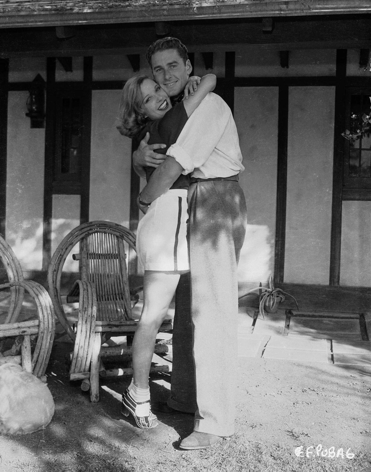 Errol Flynn Hugging A Young Woman, Possibly Lili Damita, Circa 1935.