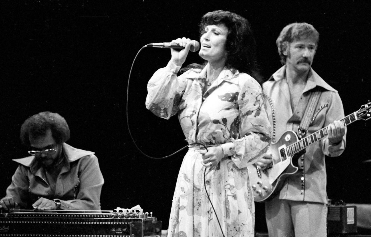 Loretta Lynn Performing On The Stage.