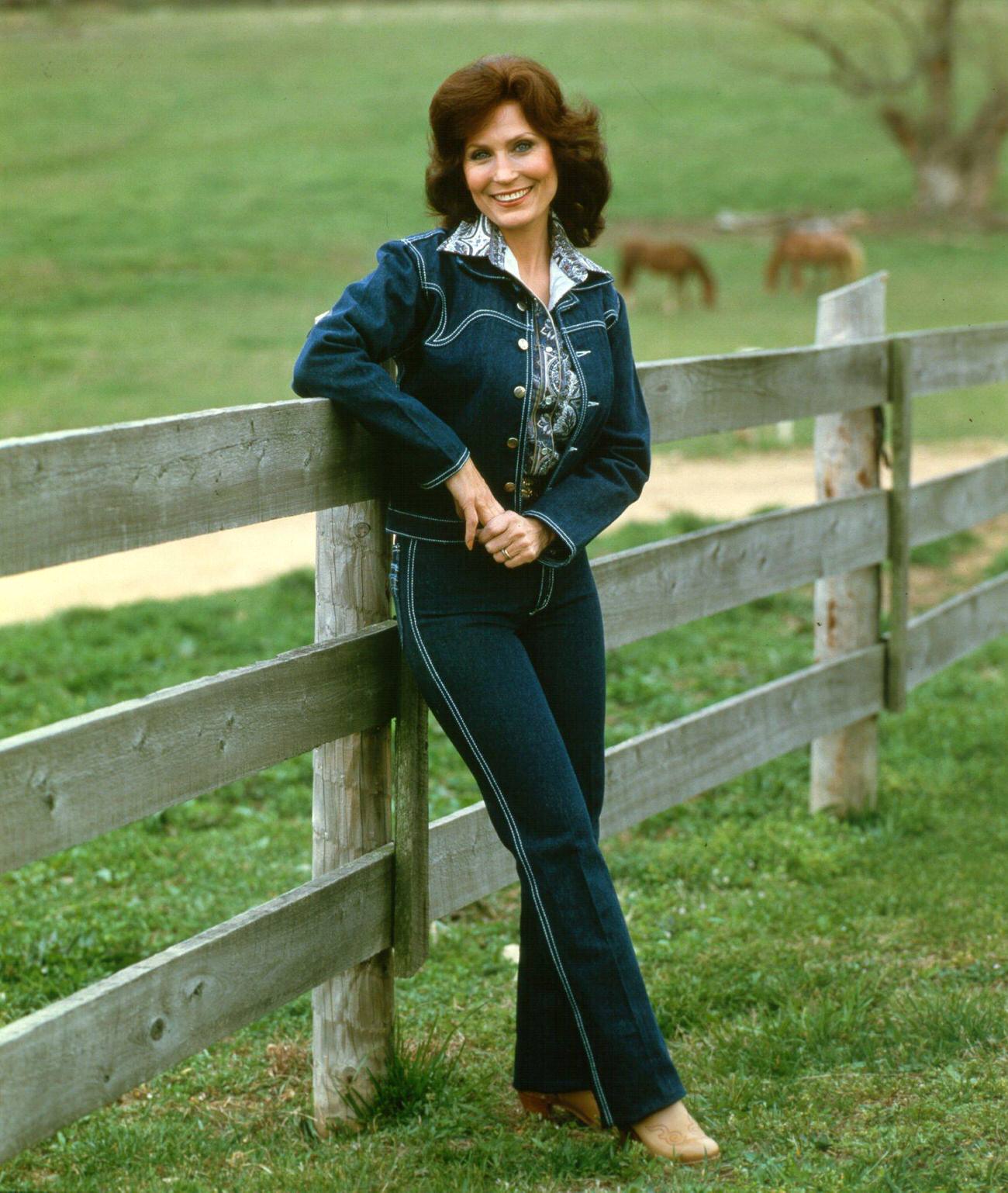 Loretta Lynn Poses For A Portrait Wearing A Blue Denim Suit, Circa 1972.