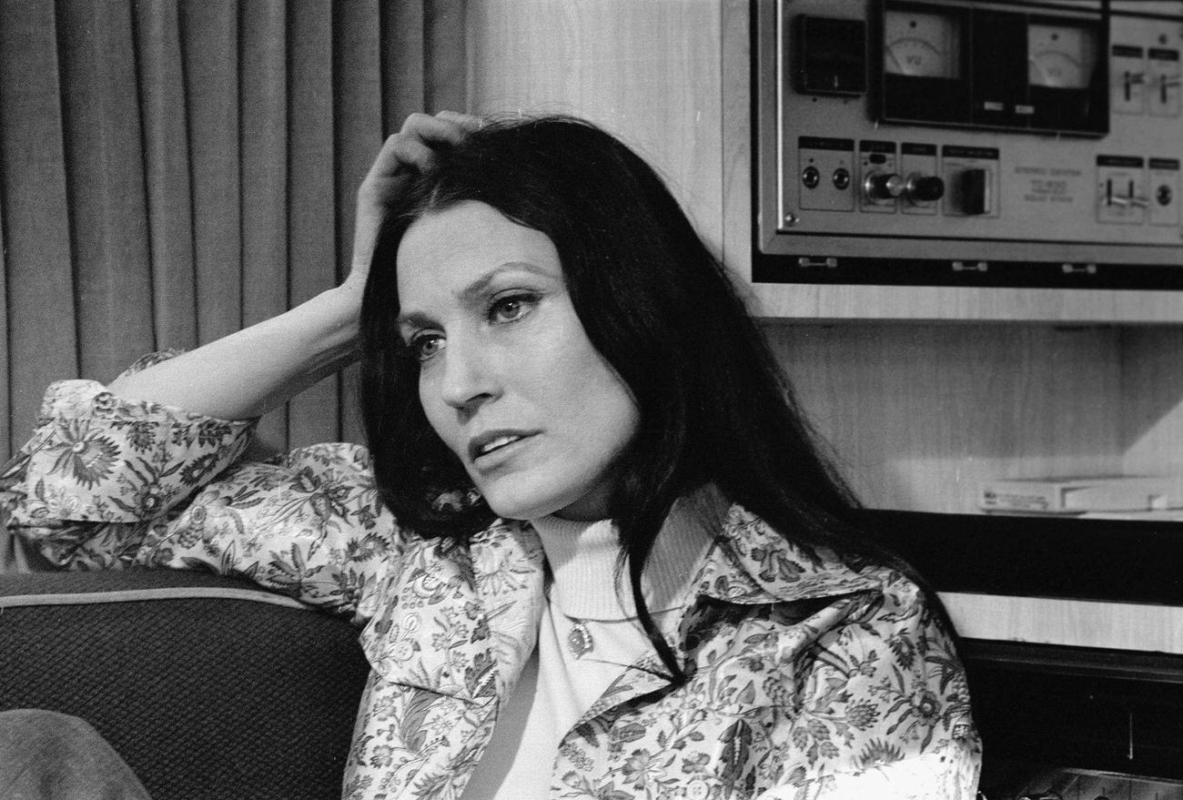 Loretta Lynn Reclines On A Couch Near Audio Equipment, February 24, 1975.