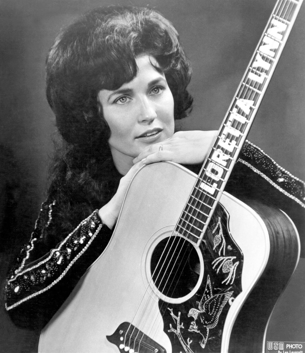 Loretta Lynn Poses For A Portrait Holding A Guitar In Nashville, Tennessee, 1962.