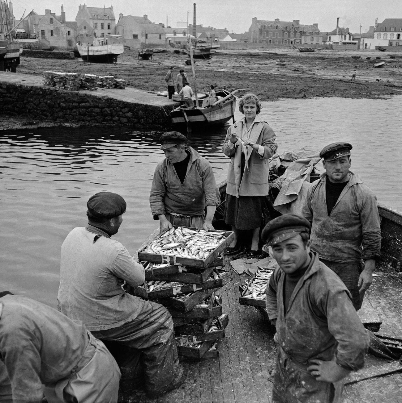 Maria Schell Among Fishermen On The Set Of 'Dans Tes Bras' In Brittany, France, 1954.