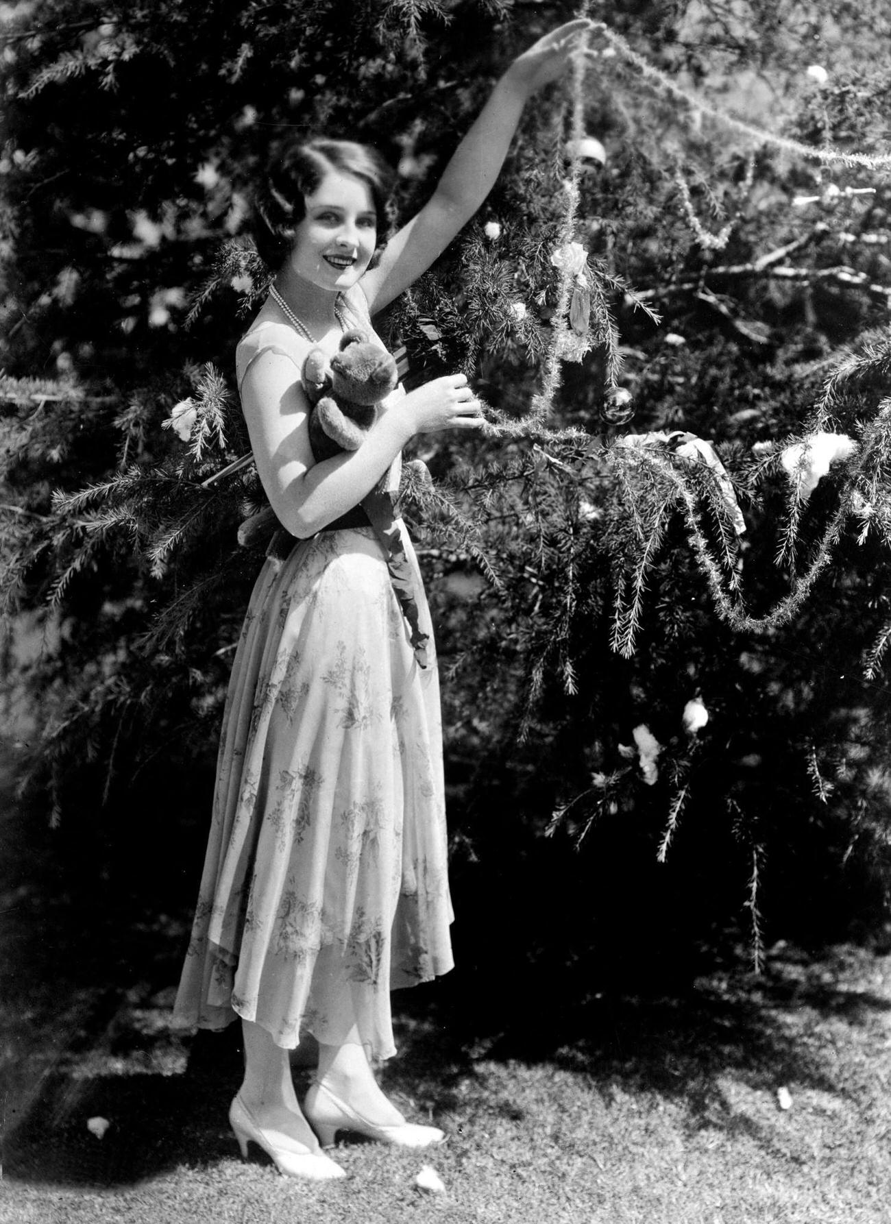 Norma Shearer Decorating A Christmas Tree, Circa 1925.