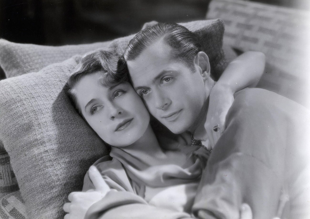 Norma Shearer And Robert Montgomery In &Amp;Quot;Private Lives&Amp;Quot; At The Chicago Theater, Lying On A Couch Embracing.