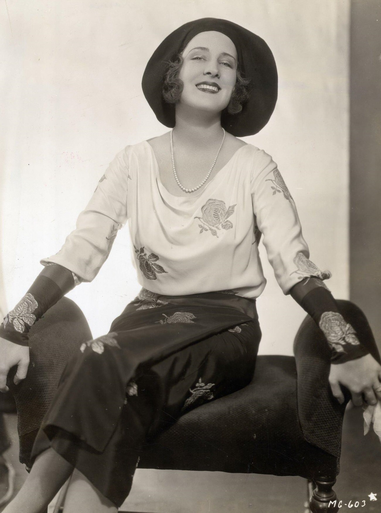 Norma Shearer In A Black And White Ensemble With Embroidered Flowers, 1930.