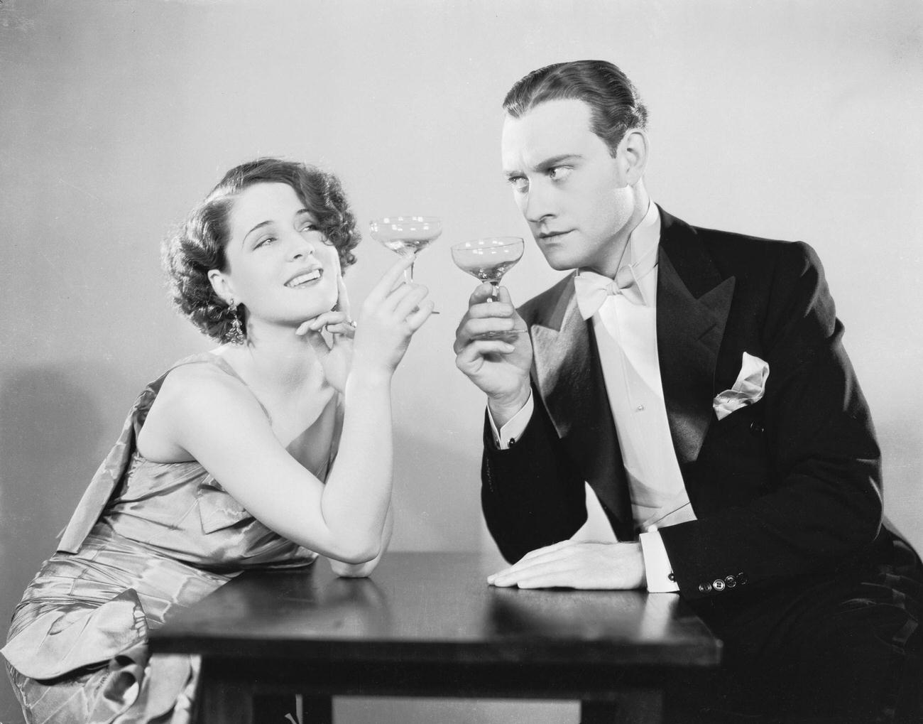 Norma Shearer Sharing A Drink With Conrad Nagel In 'The Divorcee', February 18, 1930.