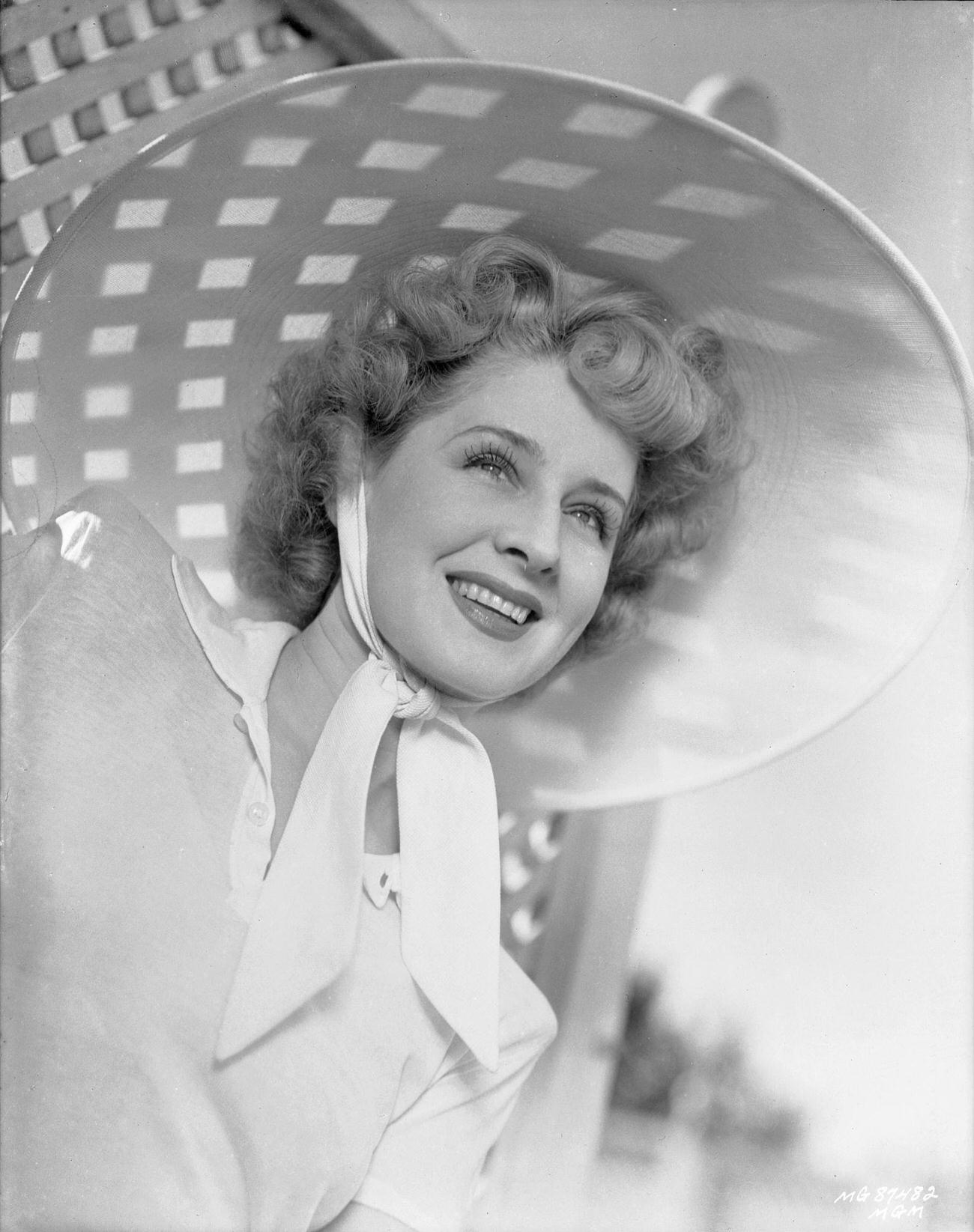 Norma Shearer Wearing A Large Sunhat Criss-Crossed With Shadow, Circa 1934.