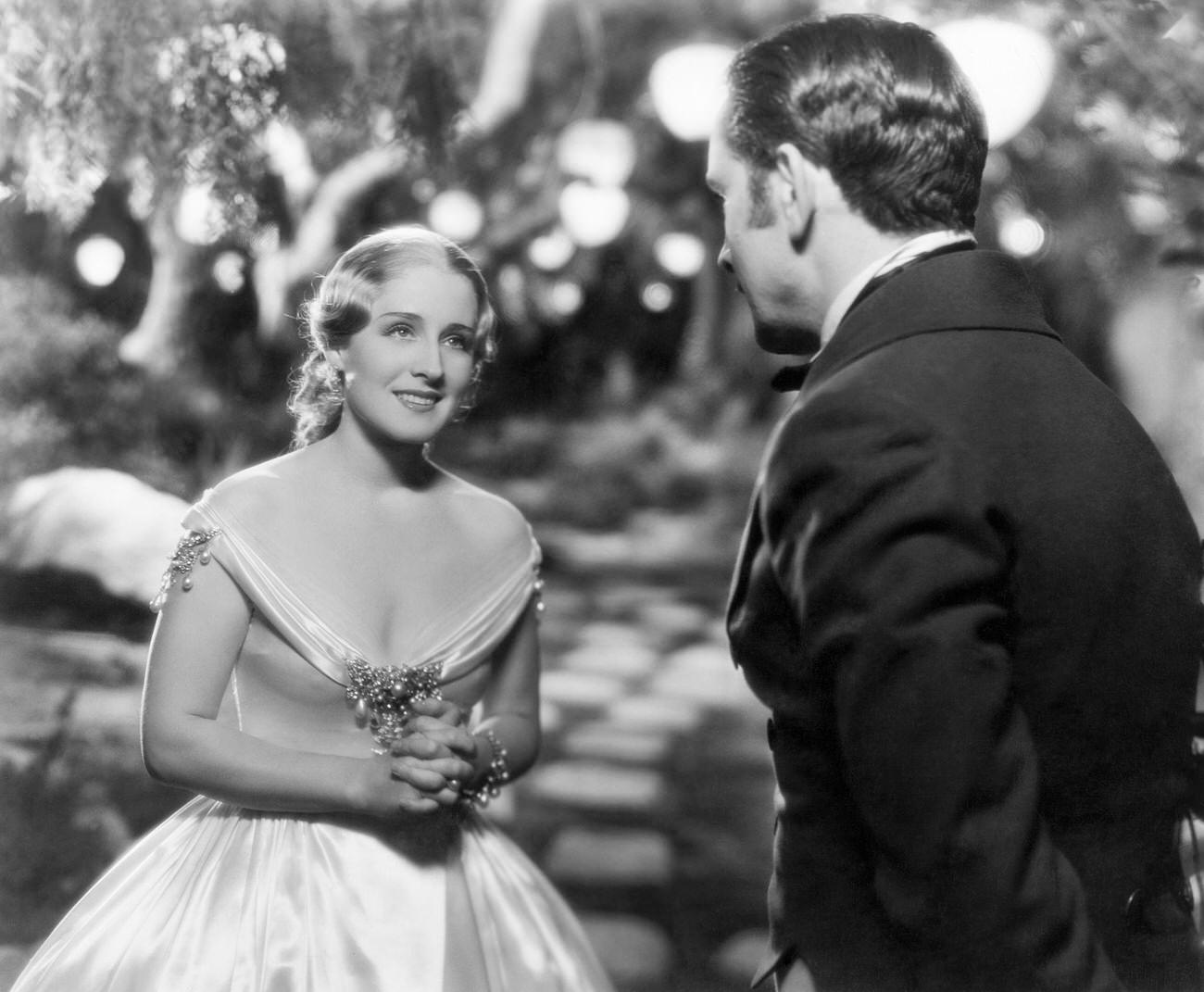Norma Shearer And Frederic March In &Amp;Quot;Smilin' Through,&Amp;Quot; In An Old English Garden Scene, 1957.