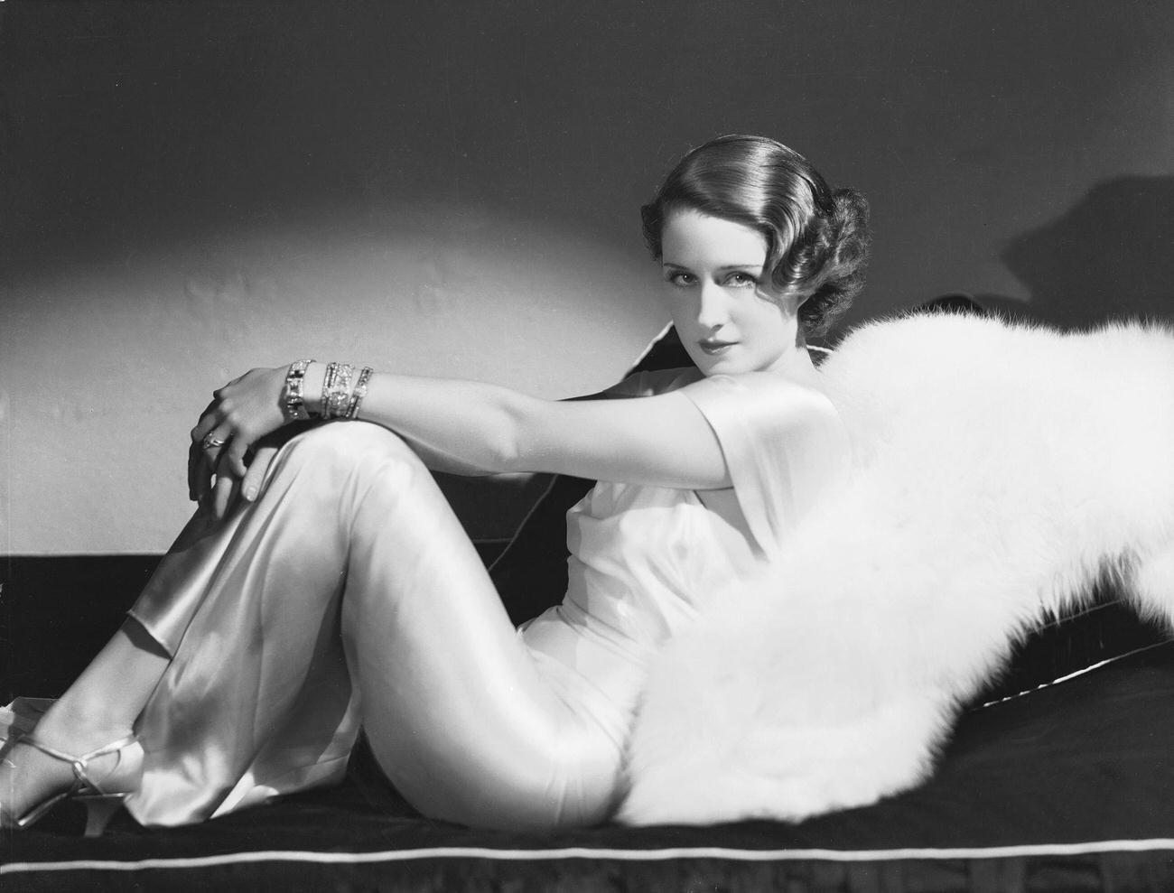 Norma Shearer Reclining In A Satin Dress, 1934.