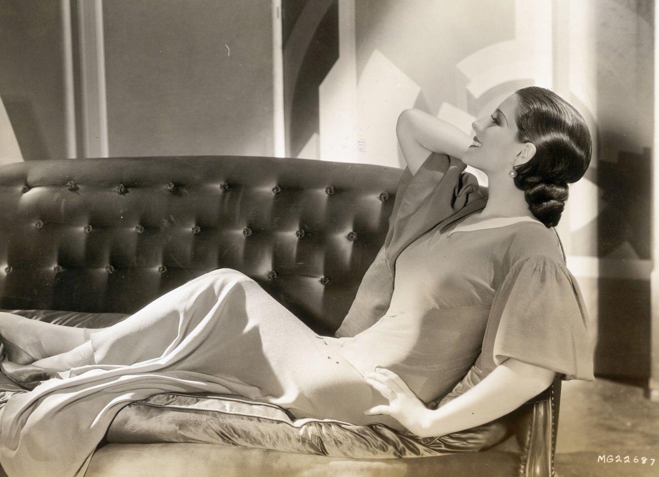 Norma Shearer Reclining On A Satin Sofa, Face In Profile.