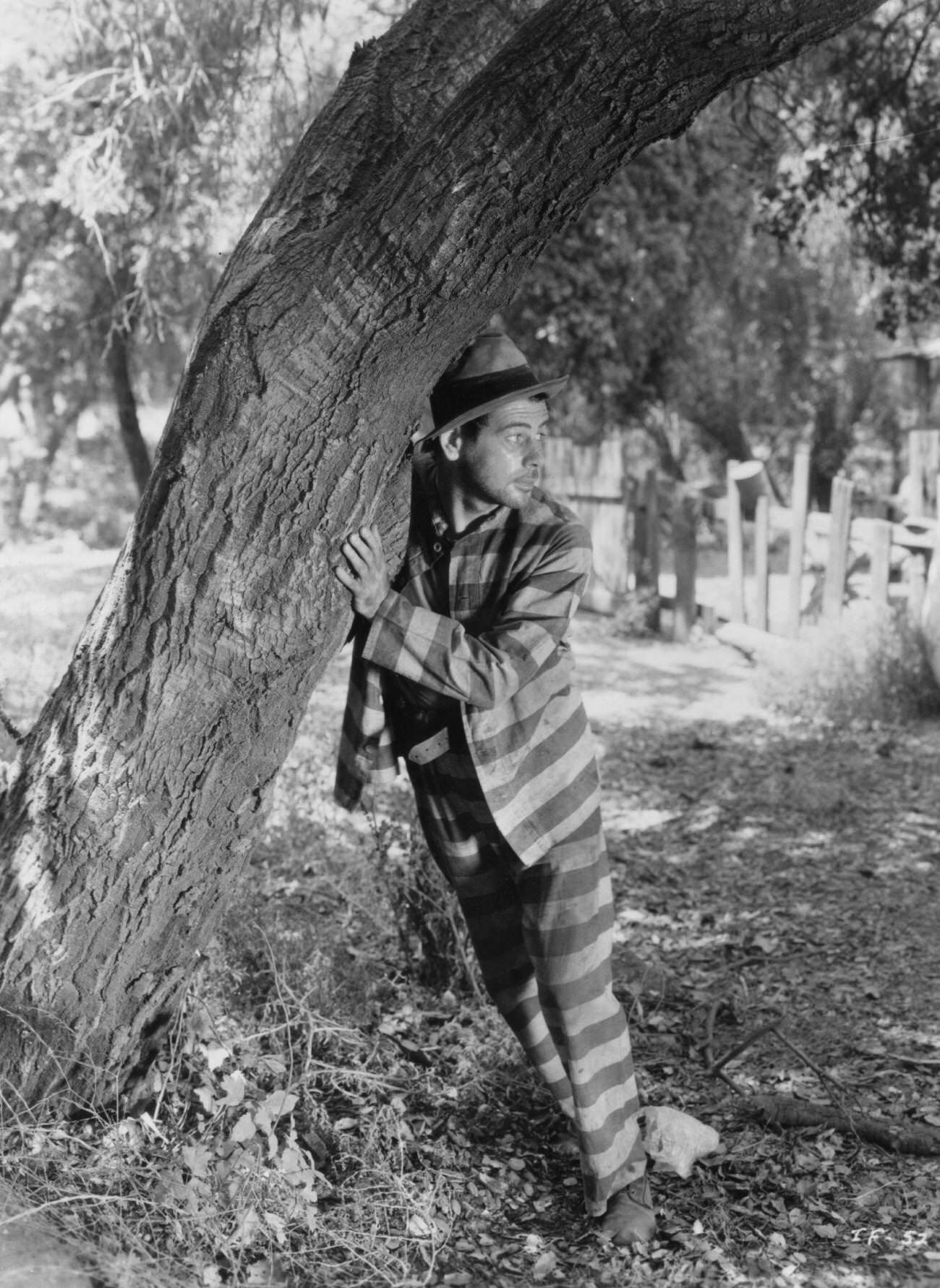 Paul Muni Hiding Behind A Tree In 'I Am A Fugitive From A Chain Gang', 1932.