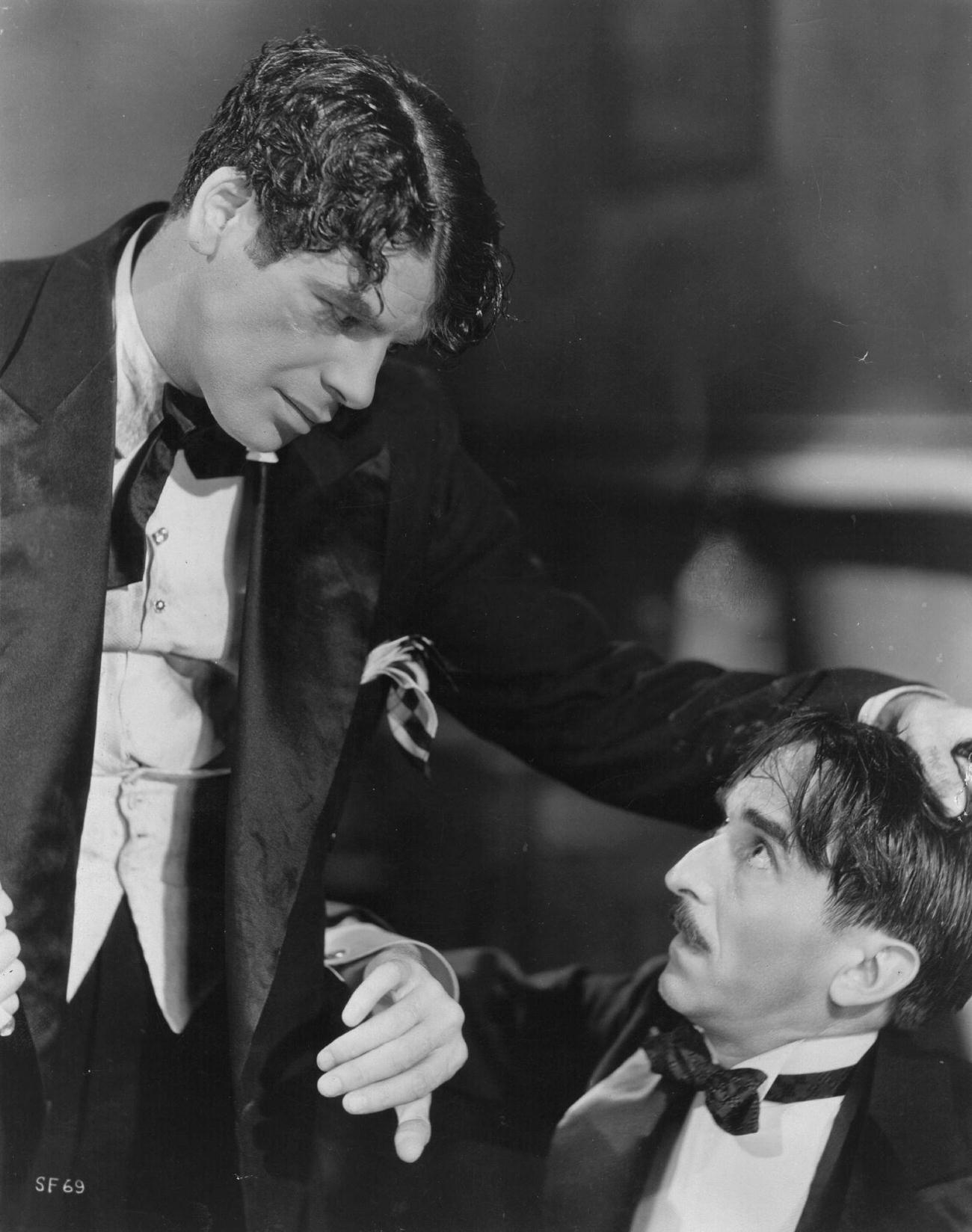 Paul Muni Threatens Osgood Perkins In 'Scarface', 1932.