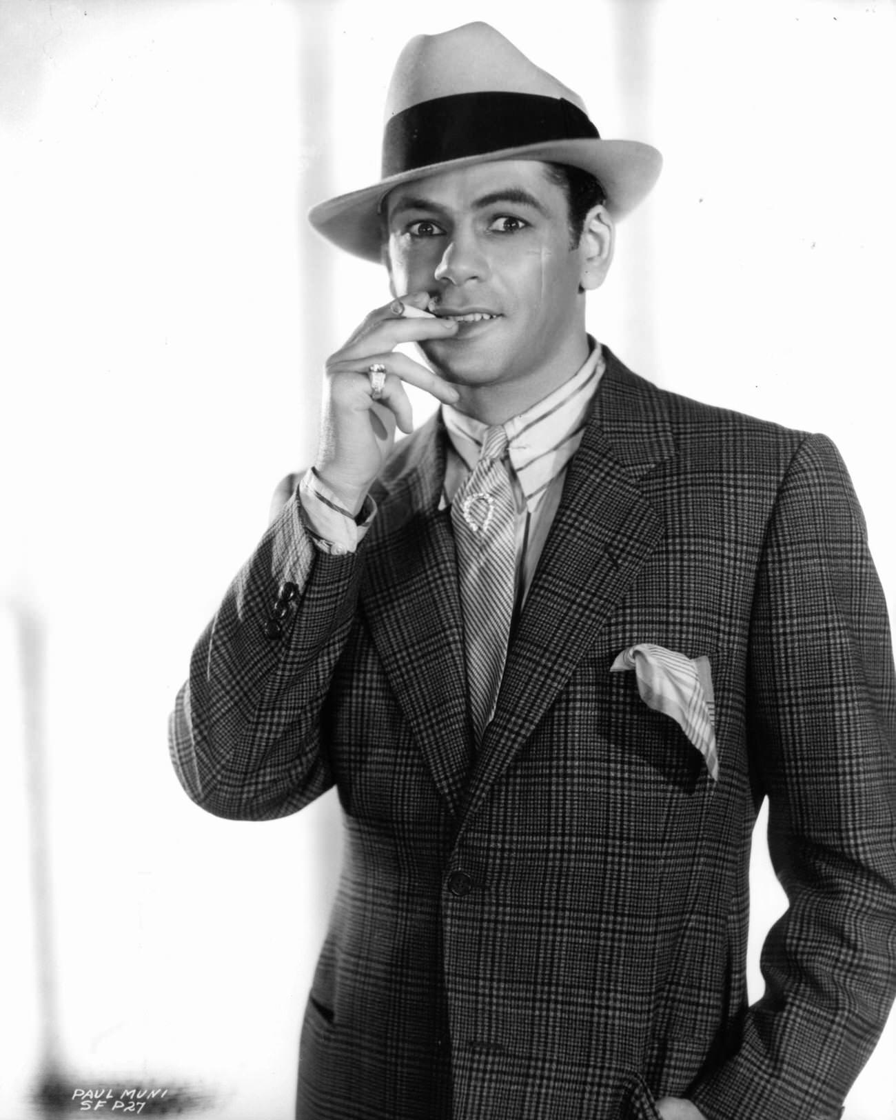 Paul Muni Smokes A Cigarette In A Publicity Portrait For 'Scarface', 1932.