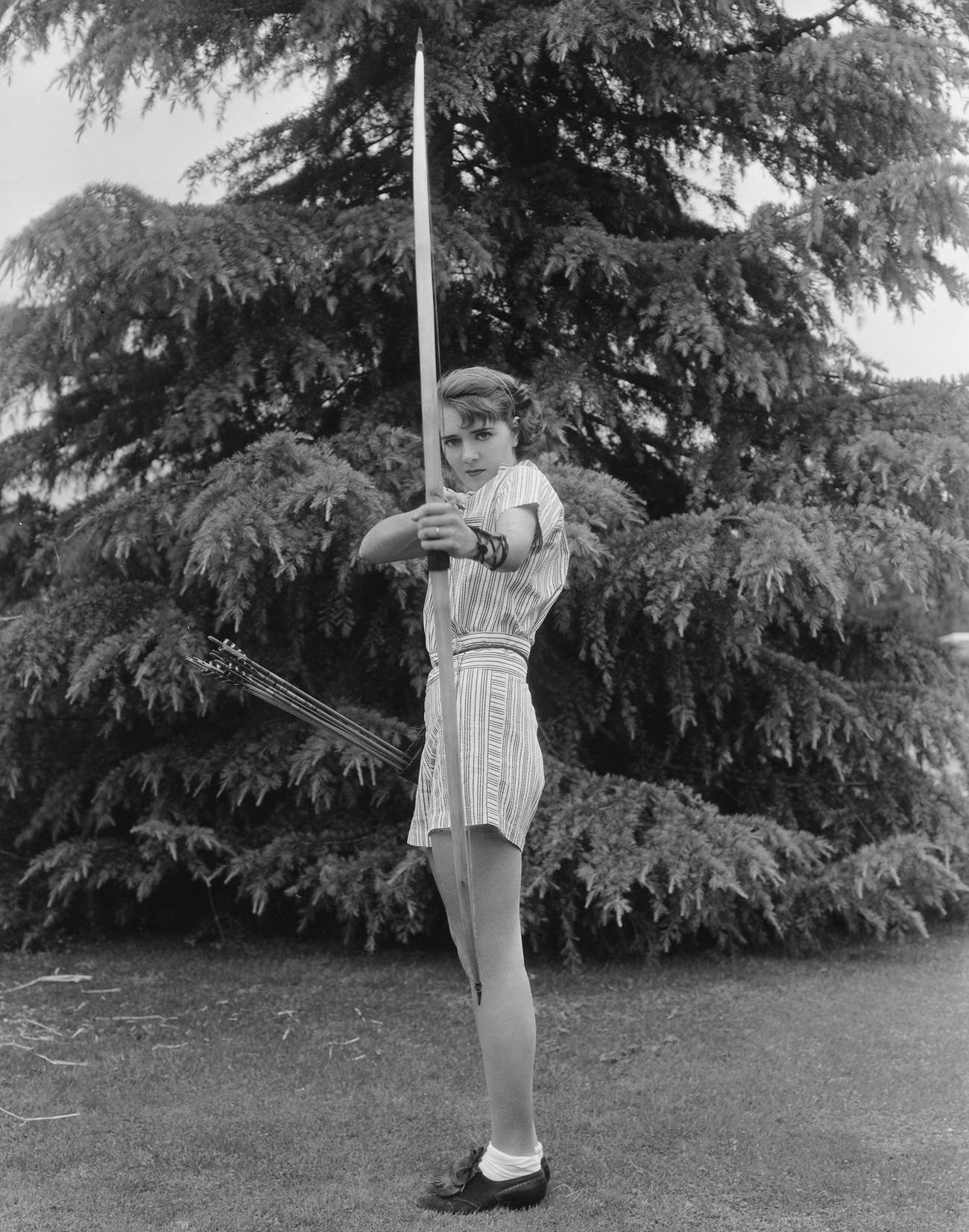 Ruby Keeler Aiming A Bow.
